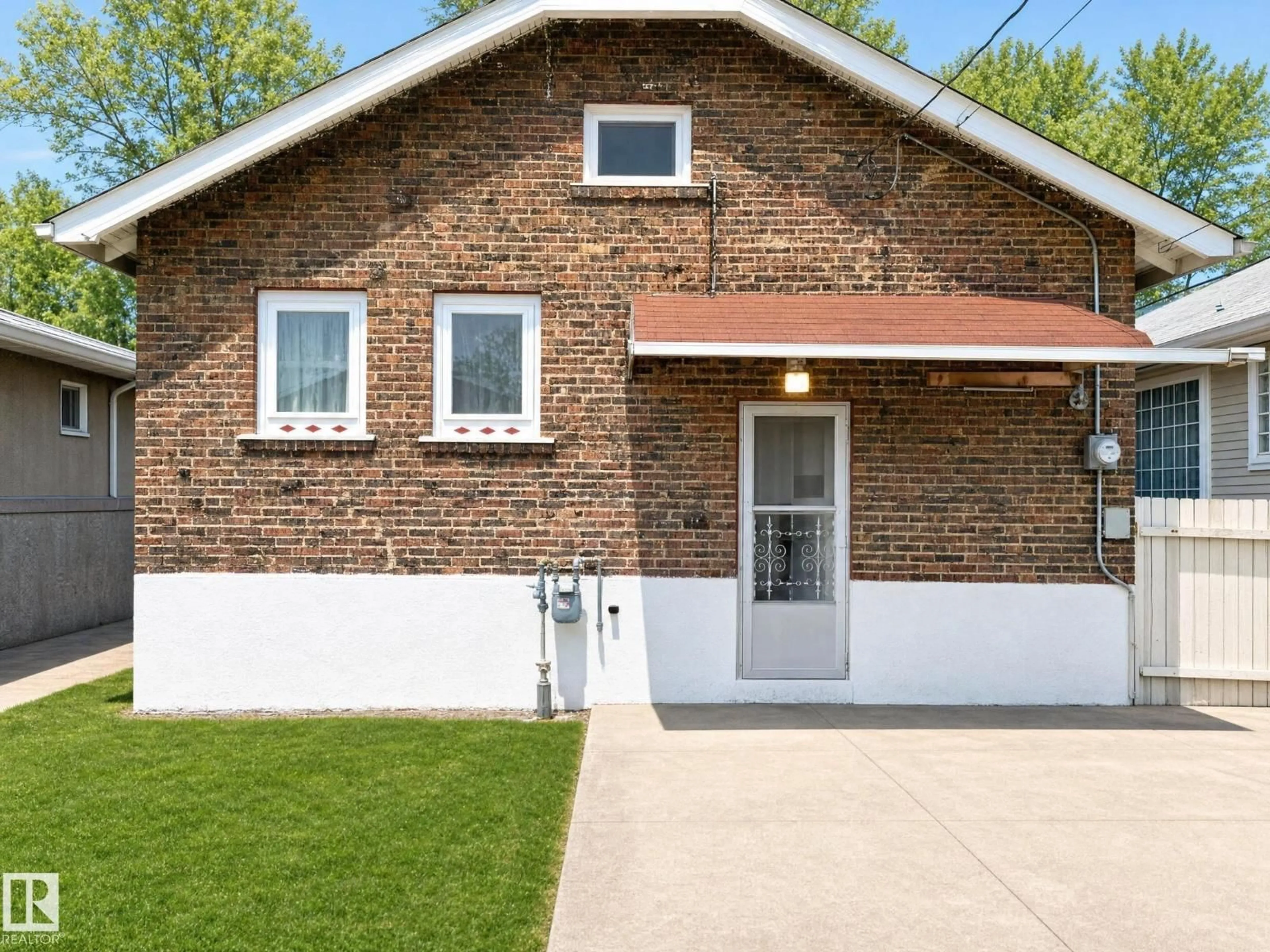 Home with brick exterior material, street for NW - 11405 97 ST, Edmonton Alberta T5G1X6