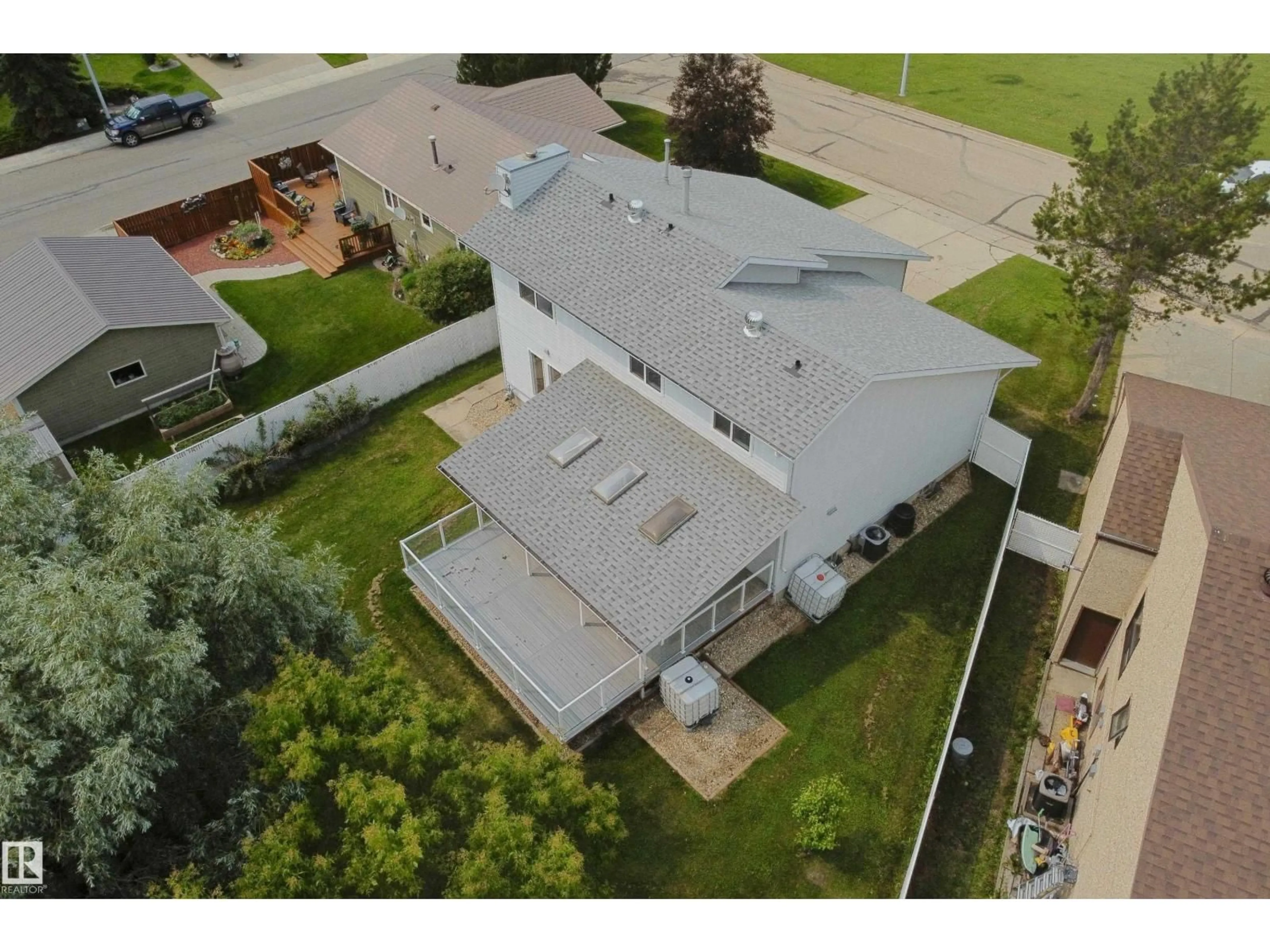 A pic from outside/outdoor area/front of a property/back of a property/a pic from drone, building for 5407 60 AVE, Barrhead Alberta T7N1E1