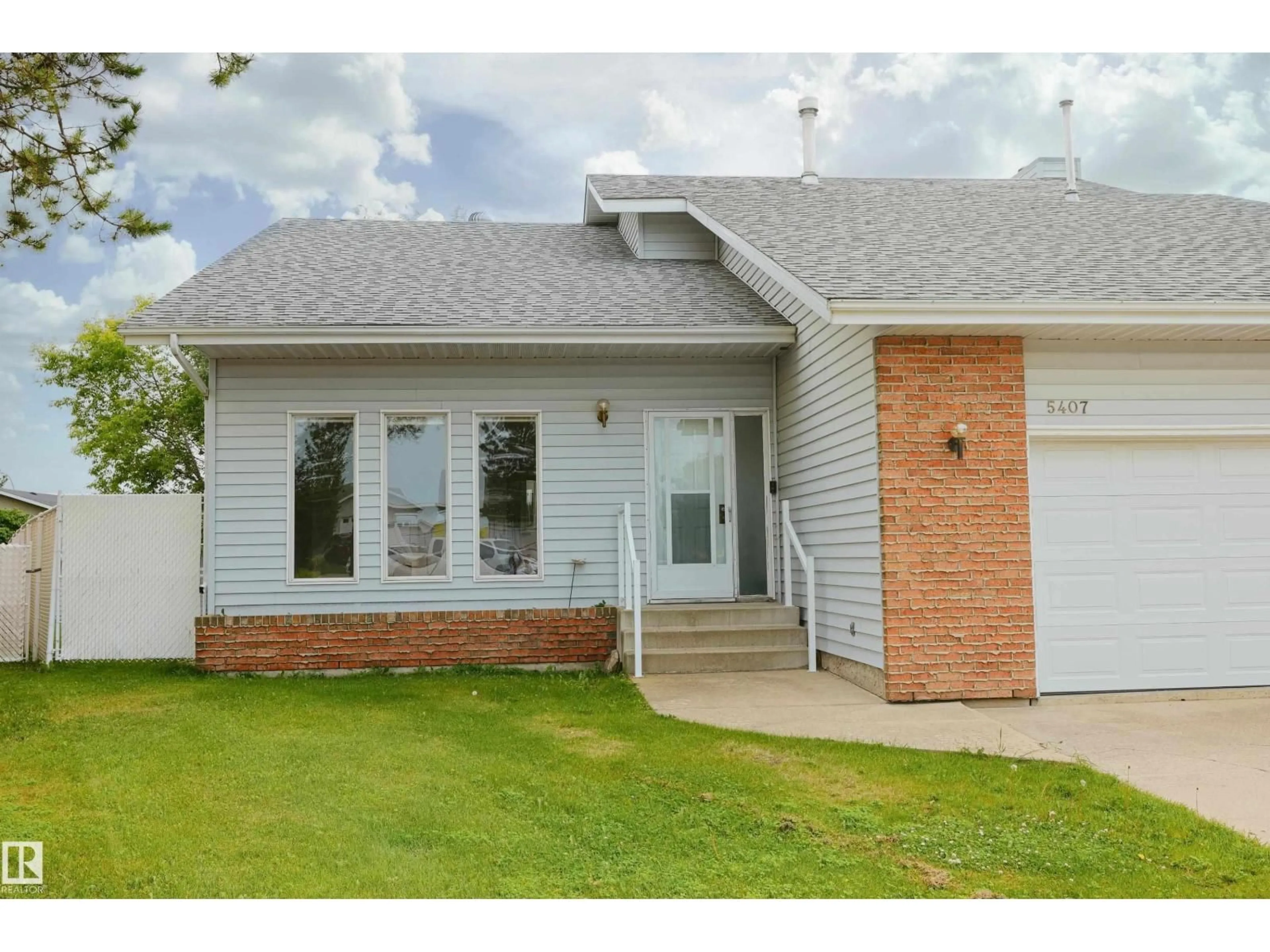 Home with vinyl exterior material, street for 5407 60 AVE, Barrhead Alberta T7N1E1
