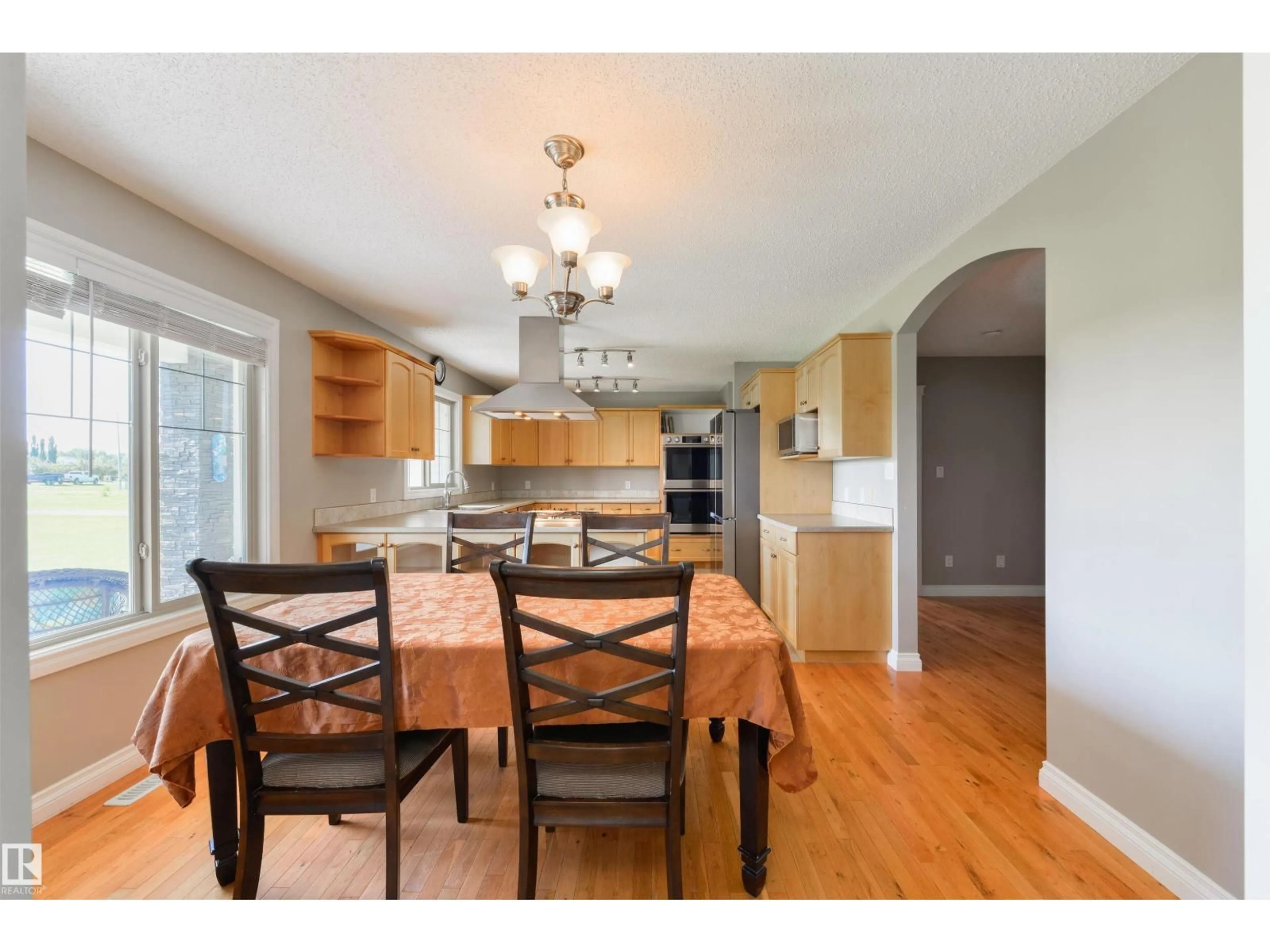 Open concept kitchen, wood/laminate floor for 45 - 53522 RGE ROAD 274, Rural Parkland County Alberta T7X3T1