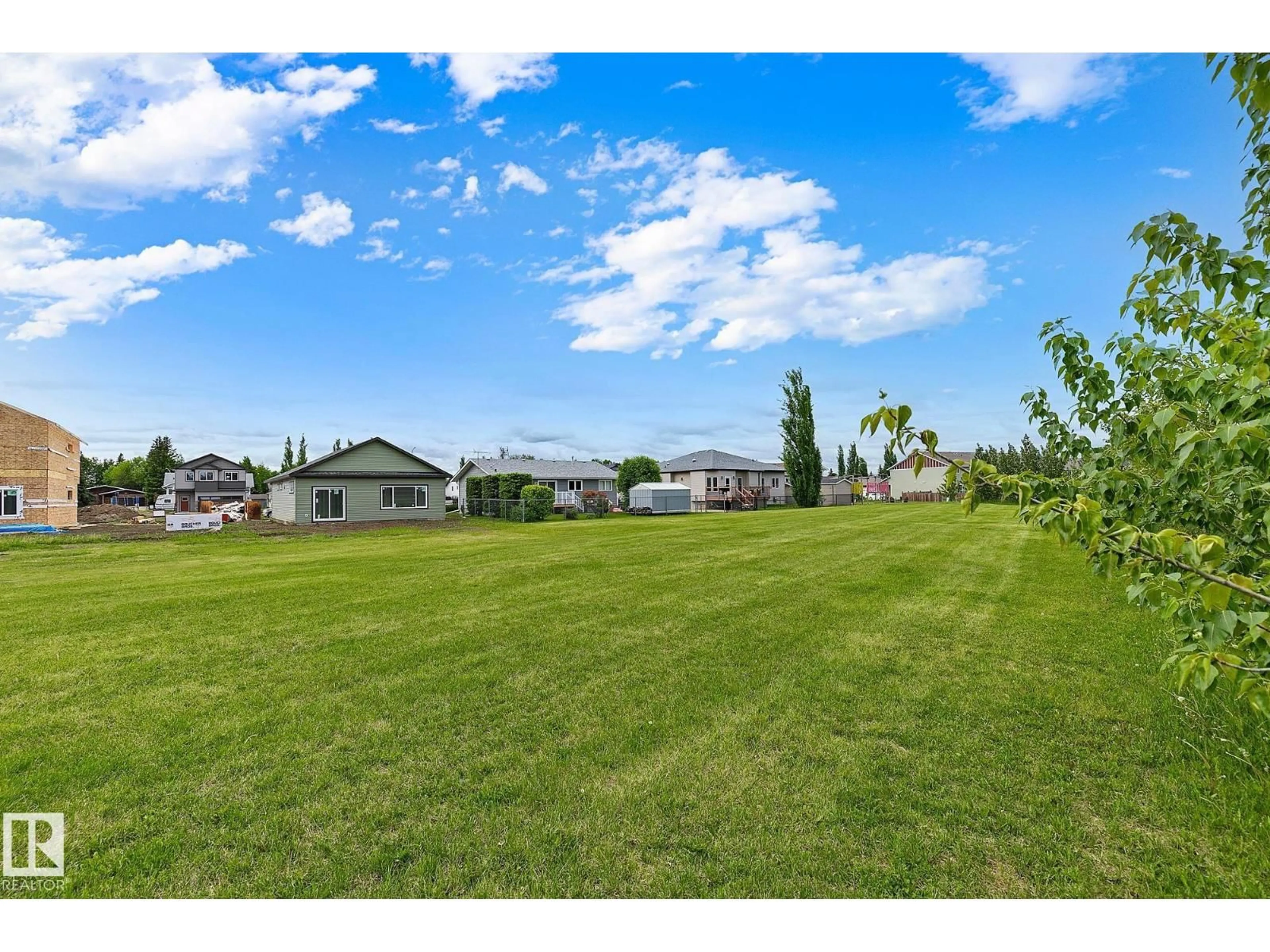 A pic from outside/outdoor area/front of a property/back of a property/a pic from drone, water/lake/river/ocean view for 4804 53 AV, Thorsby Alberta T0C2P0
