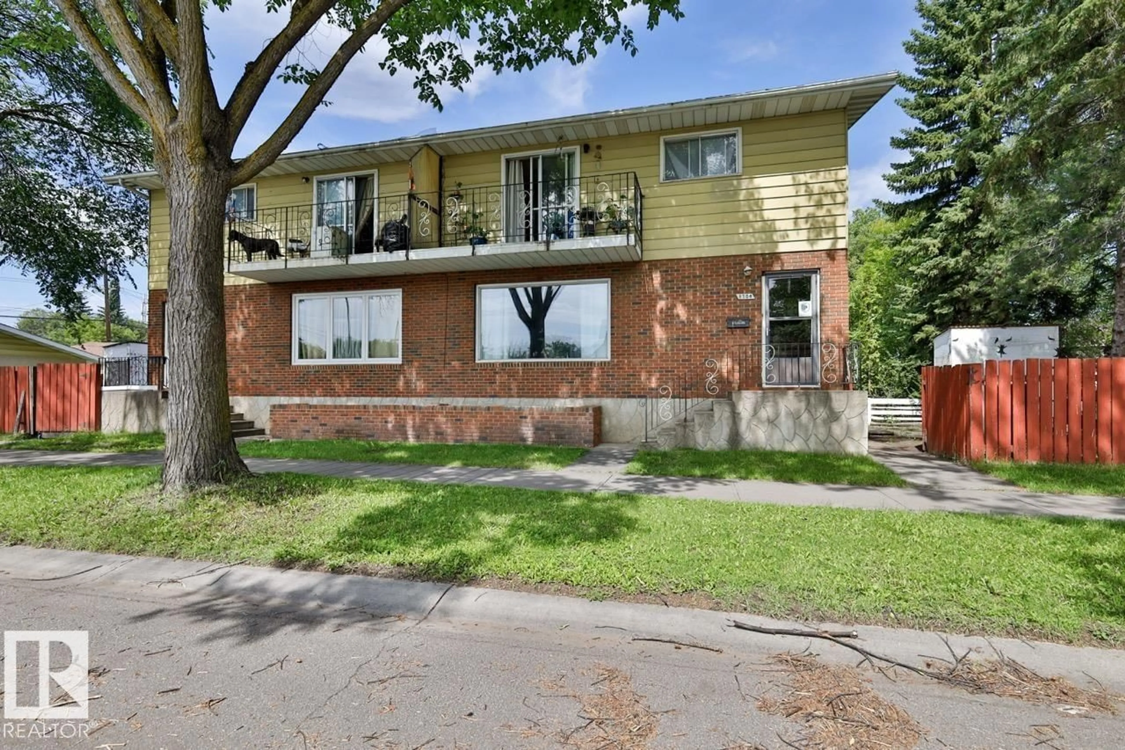 Home with brick exterior material, street for NW NW - 8704 8708 117 AV, Edmonton Alberta T5B4M1