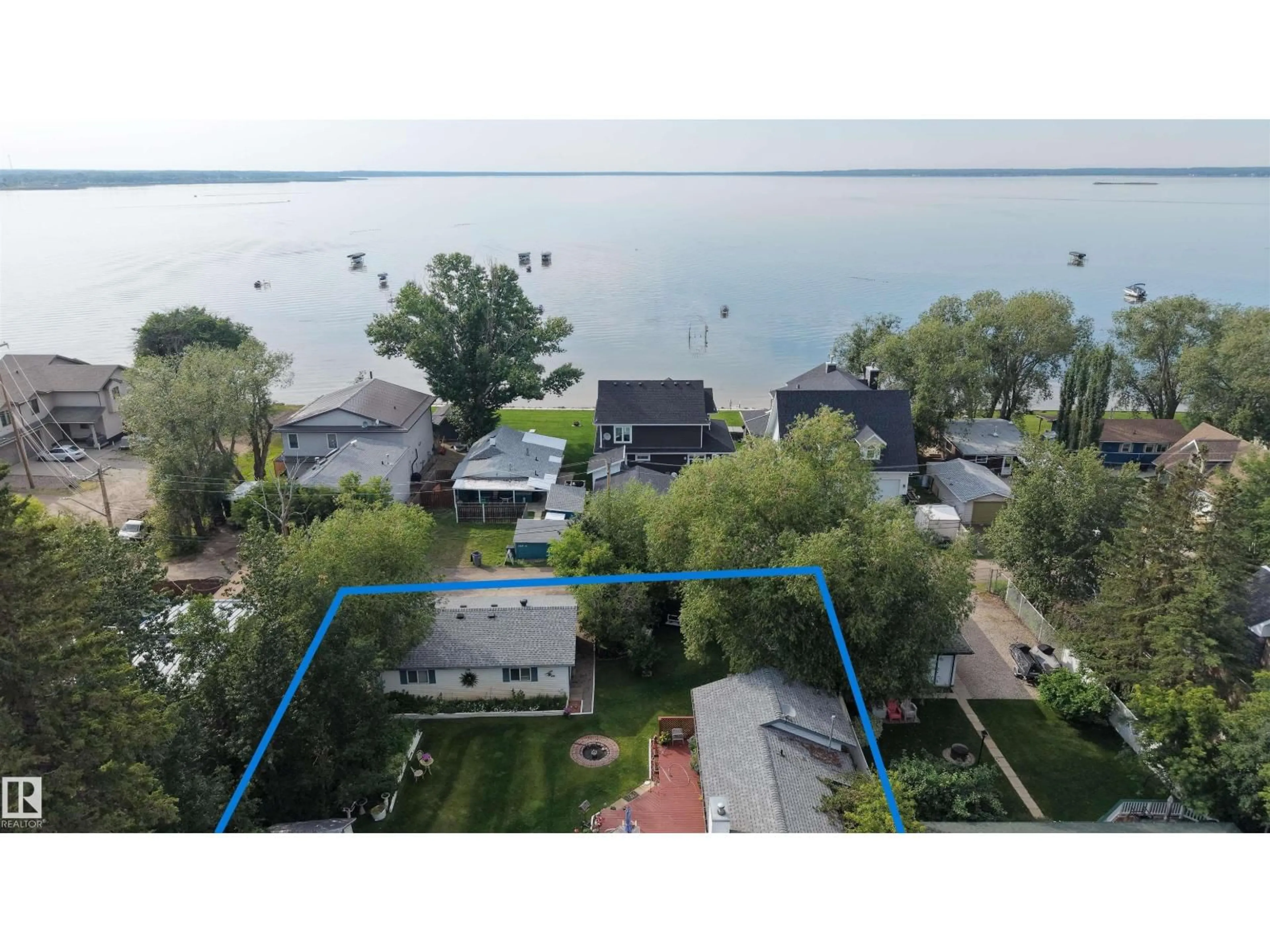 A pic from outside/outdoor area/front of a property/back of a property/a pic from drone, water/lake/river/ocean view for 5224 50 AV, Rural Lac Ste. Anne County Alberta T0E0A0
