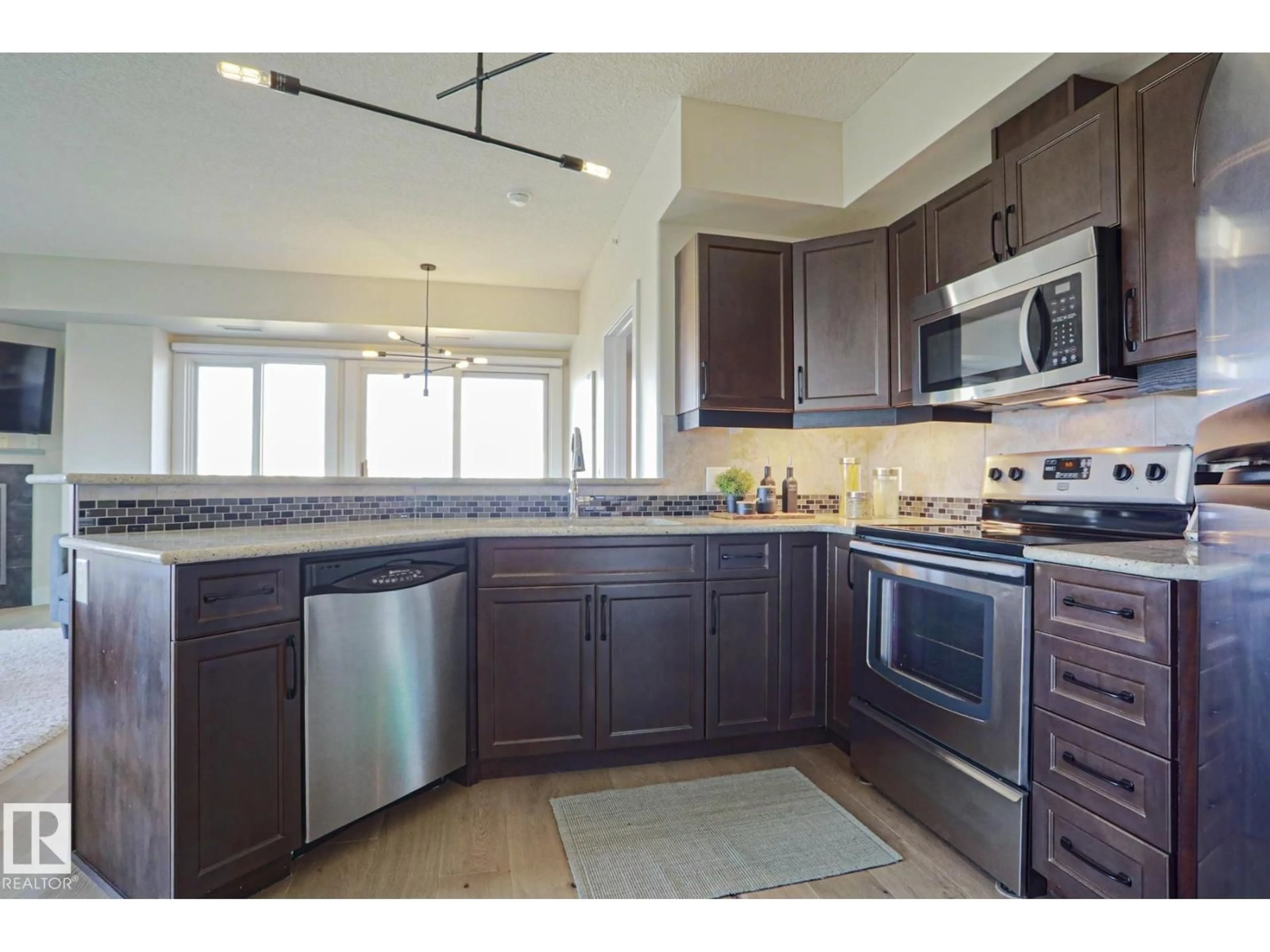 Open concept kitchen, ceramic/tile floor for 703 - 10303 111 ST NW, Edmonton Alberta T5K0C6