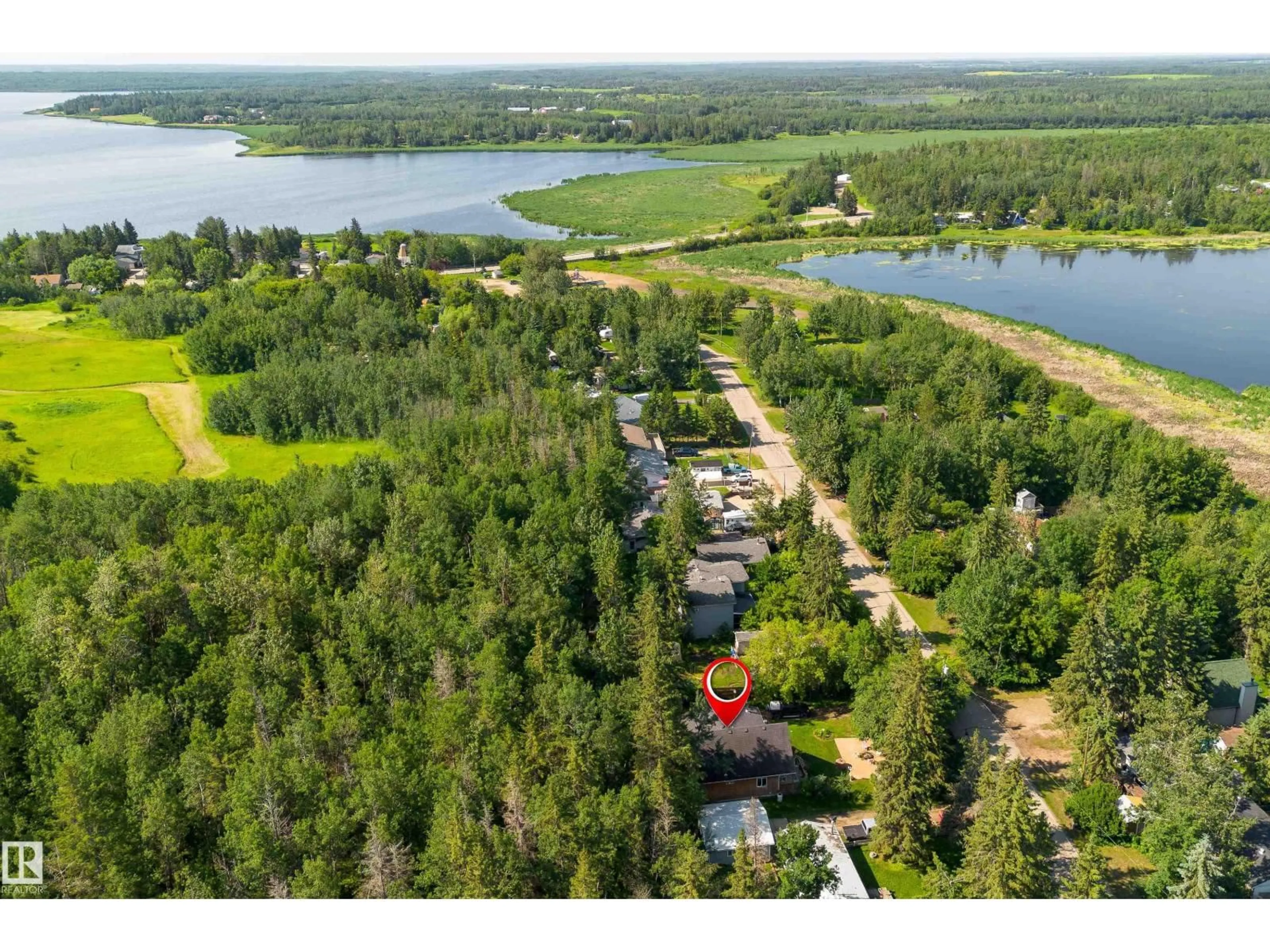 A pic from outside/outdoor area/front of a property/back of a property/a pic from drone, water/lake/river/ocean view for 130 LAKESHORE DR, Rural Lac Ste. Anne County Alberta T0E1V0