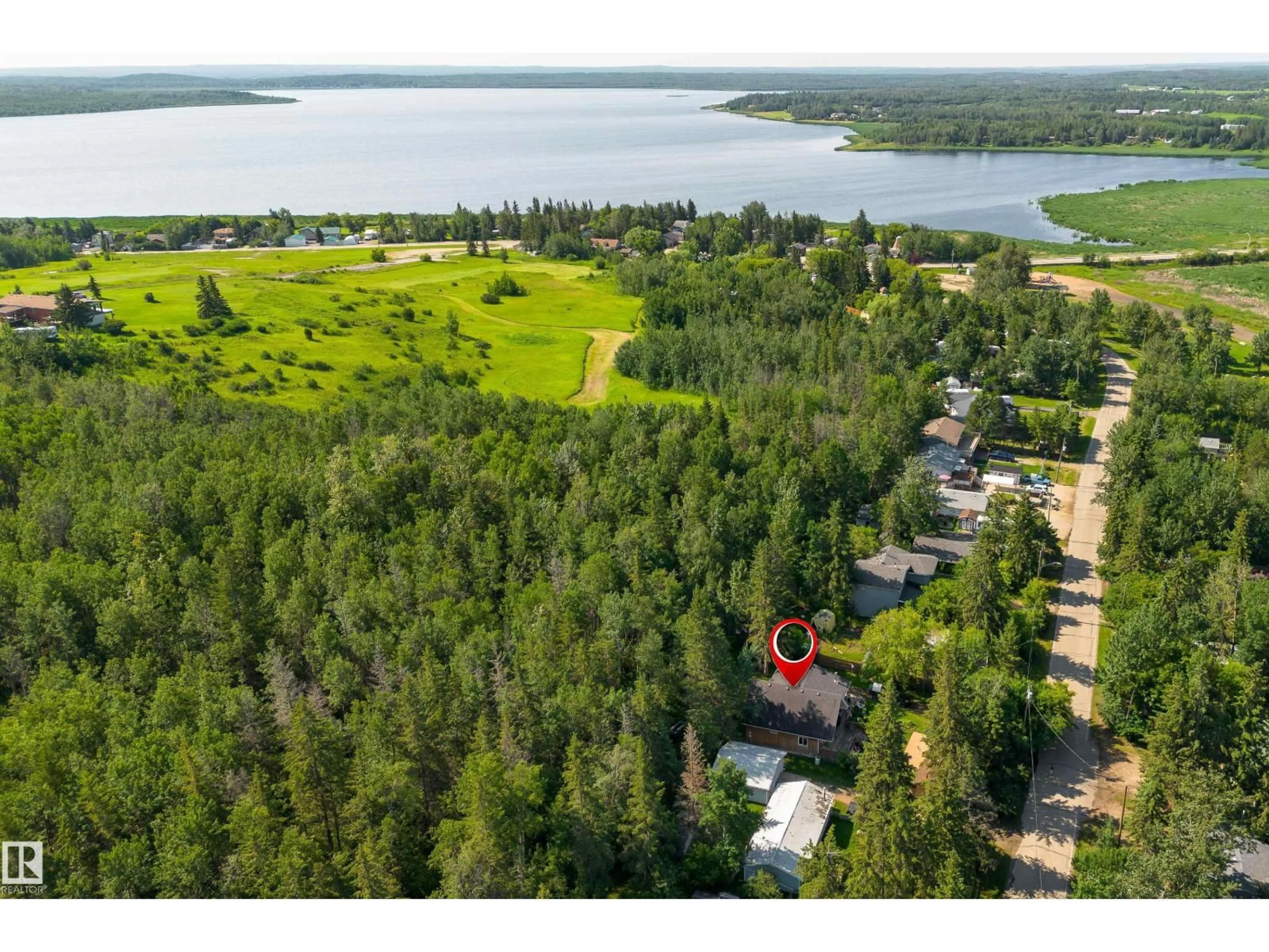 A pic from outside/outdoor area/front of a property/back of a property/a pic from drone, water/lake/river/ocean view for 130 LAKESHORE DR, Rural Lac Ste. Anne County Alberta T0E1V0