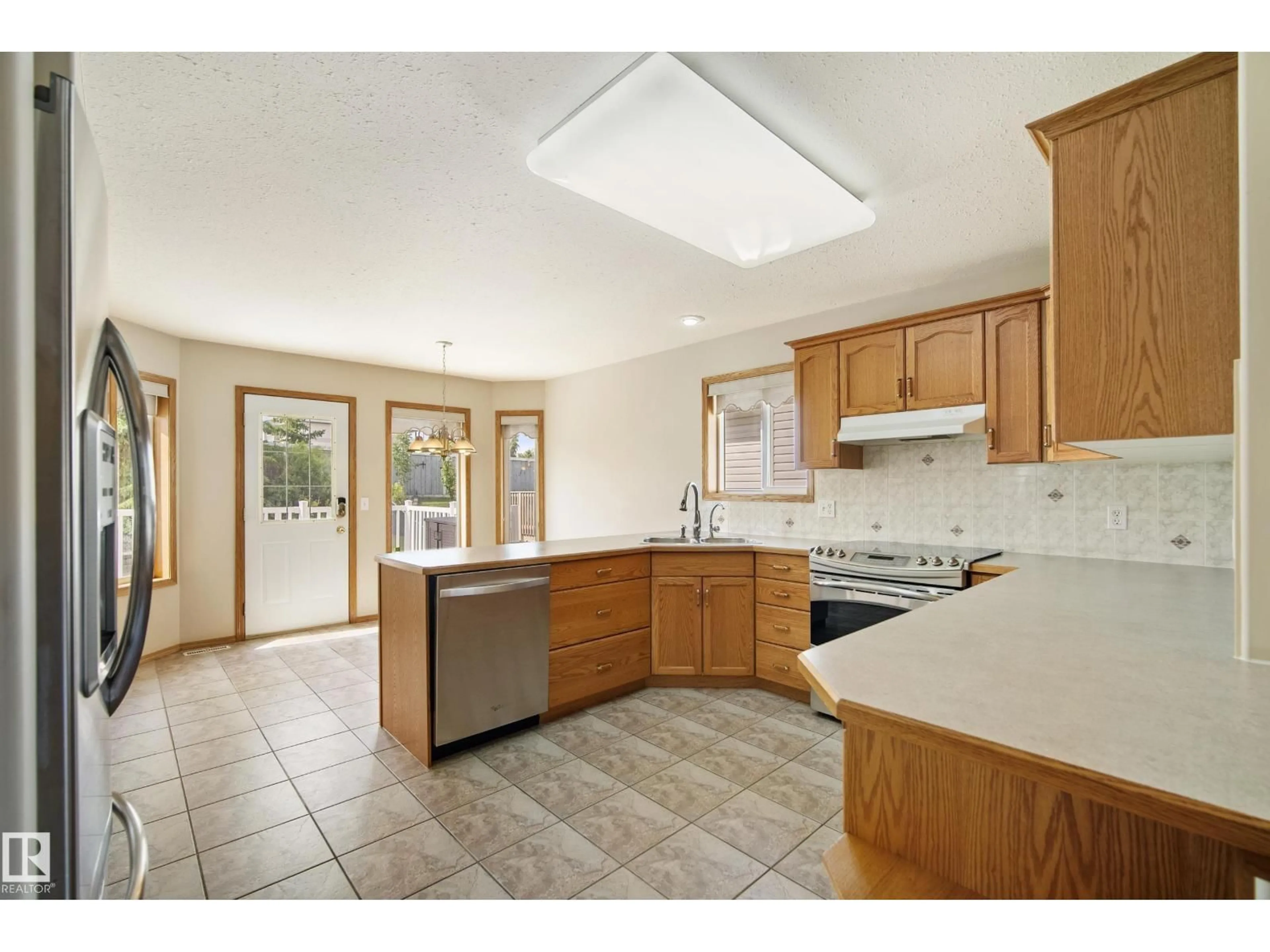 Open concept kitchen, ceramic/tile floor for 11 HAGEN CO, Spruce Grove Alberta T7X2W1