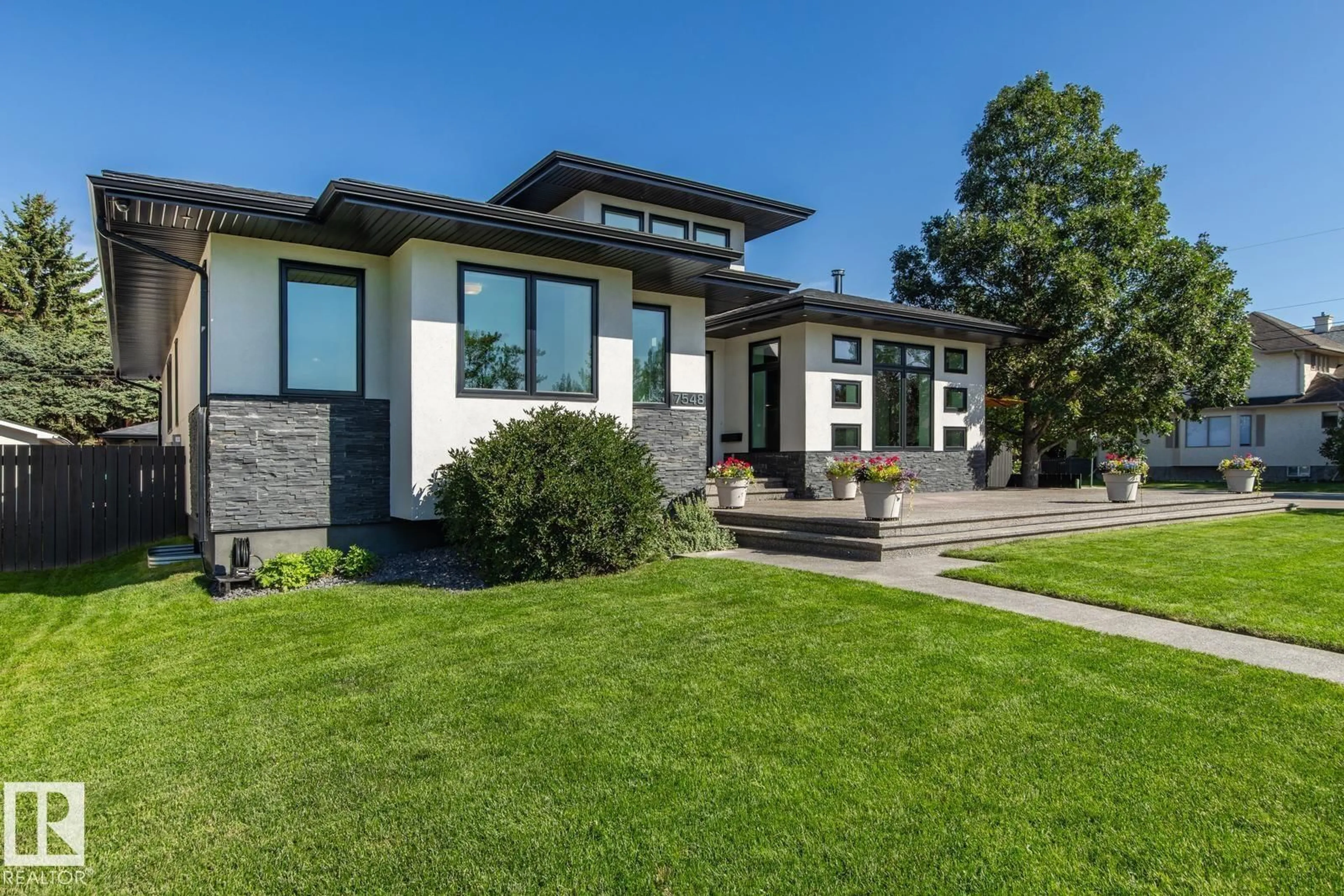 Home with brick exterior material, mountain view for 7548 110 AV, Edmonton Alberta T5B0A4
