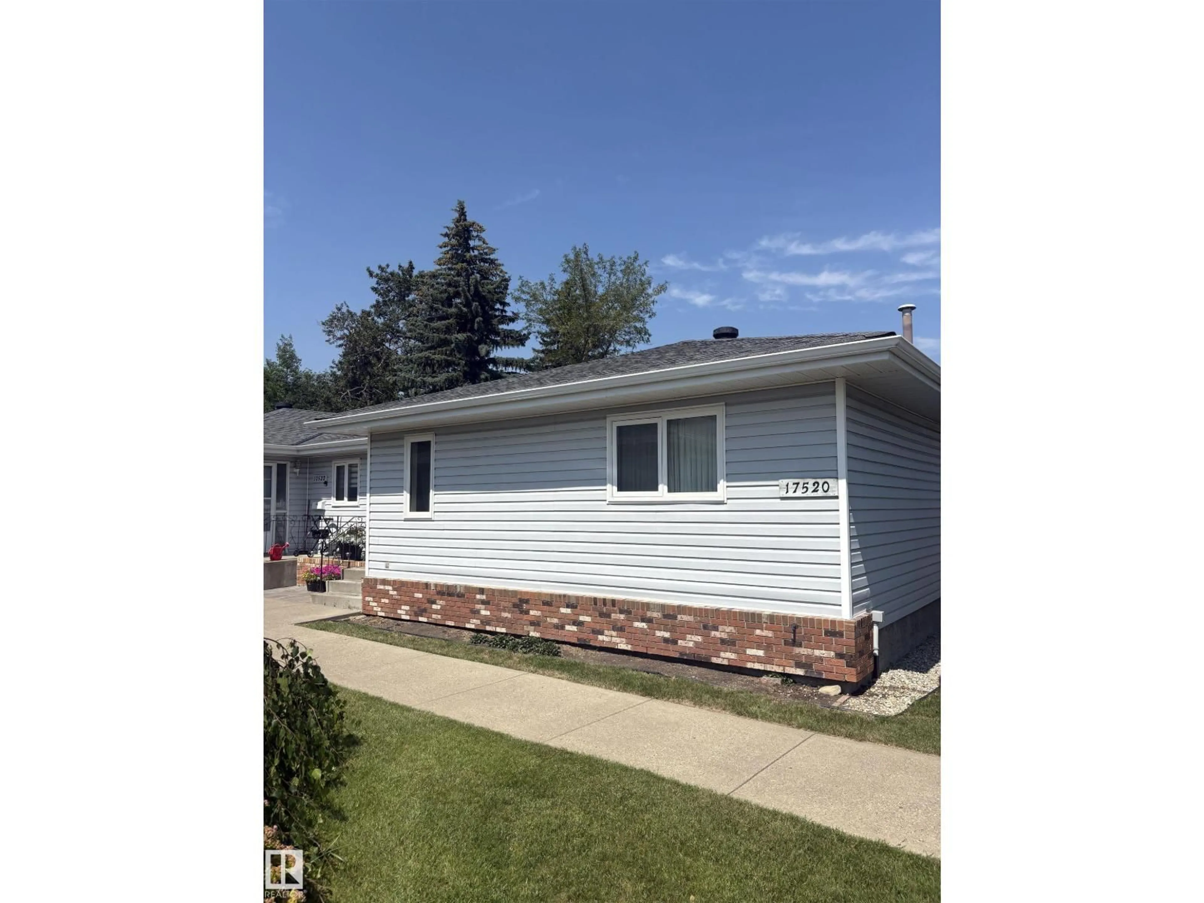 Home with vinyl exterior material, street for 17520 CALLINGWOOD RD, Edmonton Alberta T5T5P1