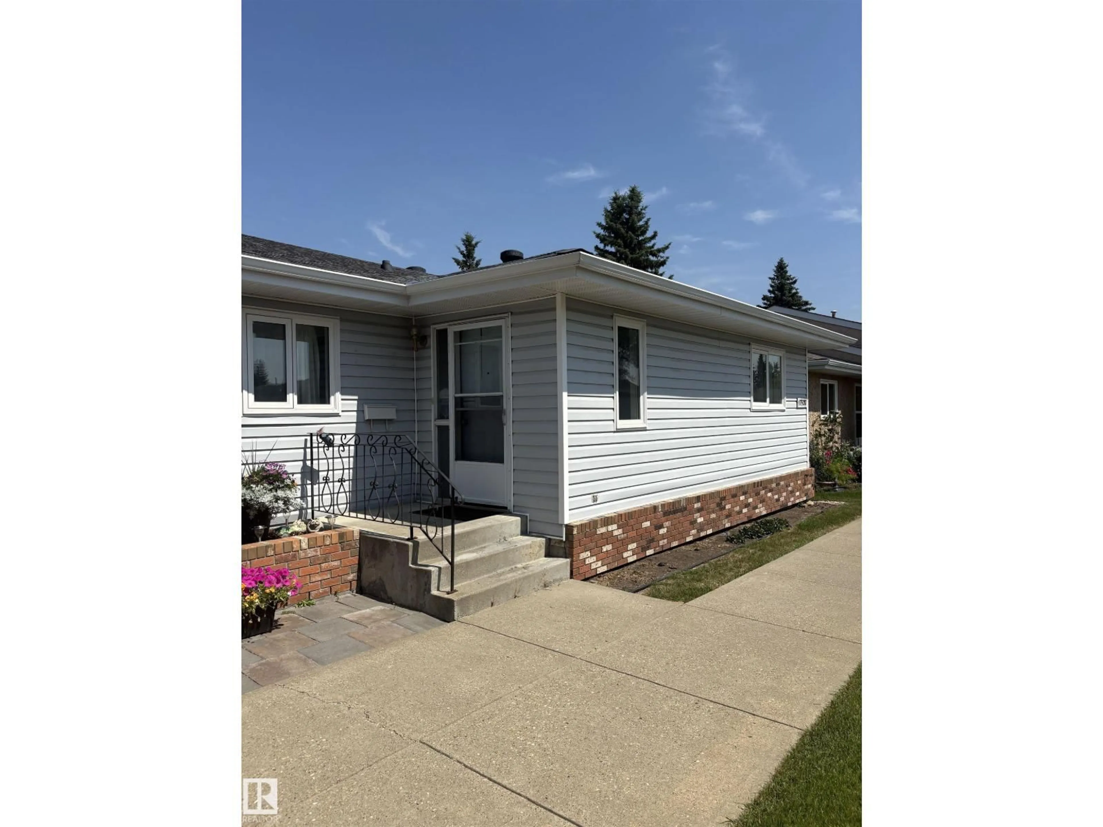 Home with vinyl exterior material, street for 17520 CALLINGWOOD RD, Edmonton Alberta T5T5P1