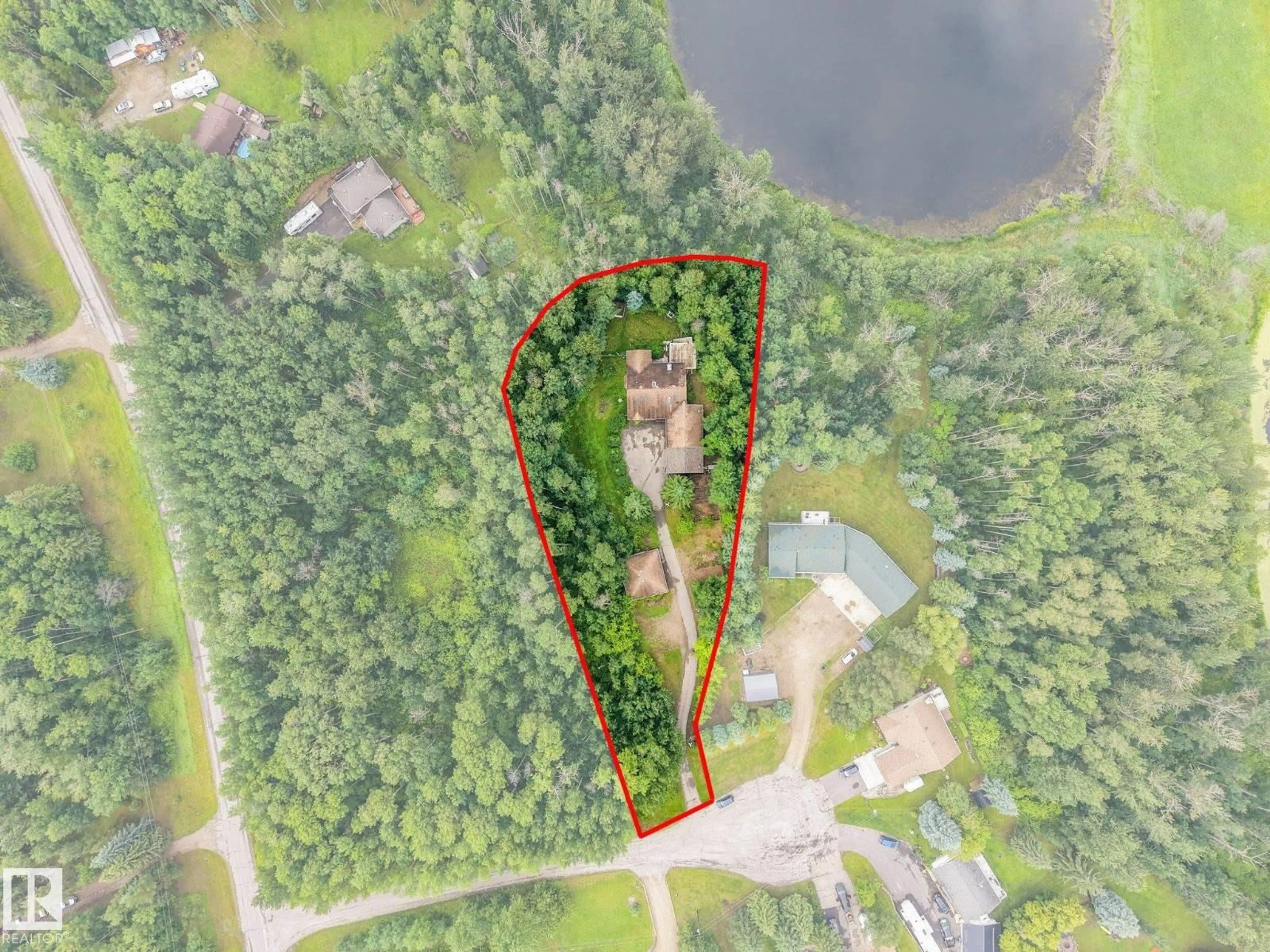 A pic from outside/outdoor area/front of a property/back of a property/a pic from drone, water/lake/river/ocean view for 2022 PARKLAND DR, Rural Parkland County Alberta T7Y2S1