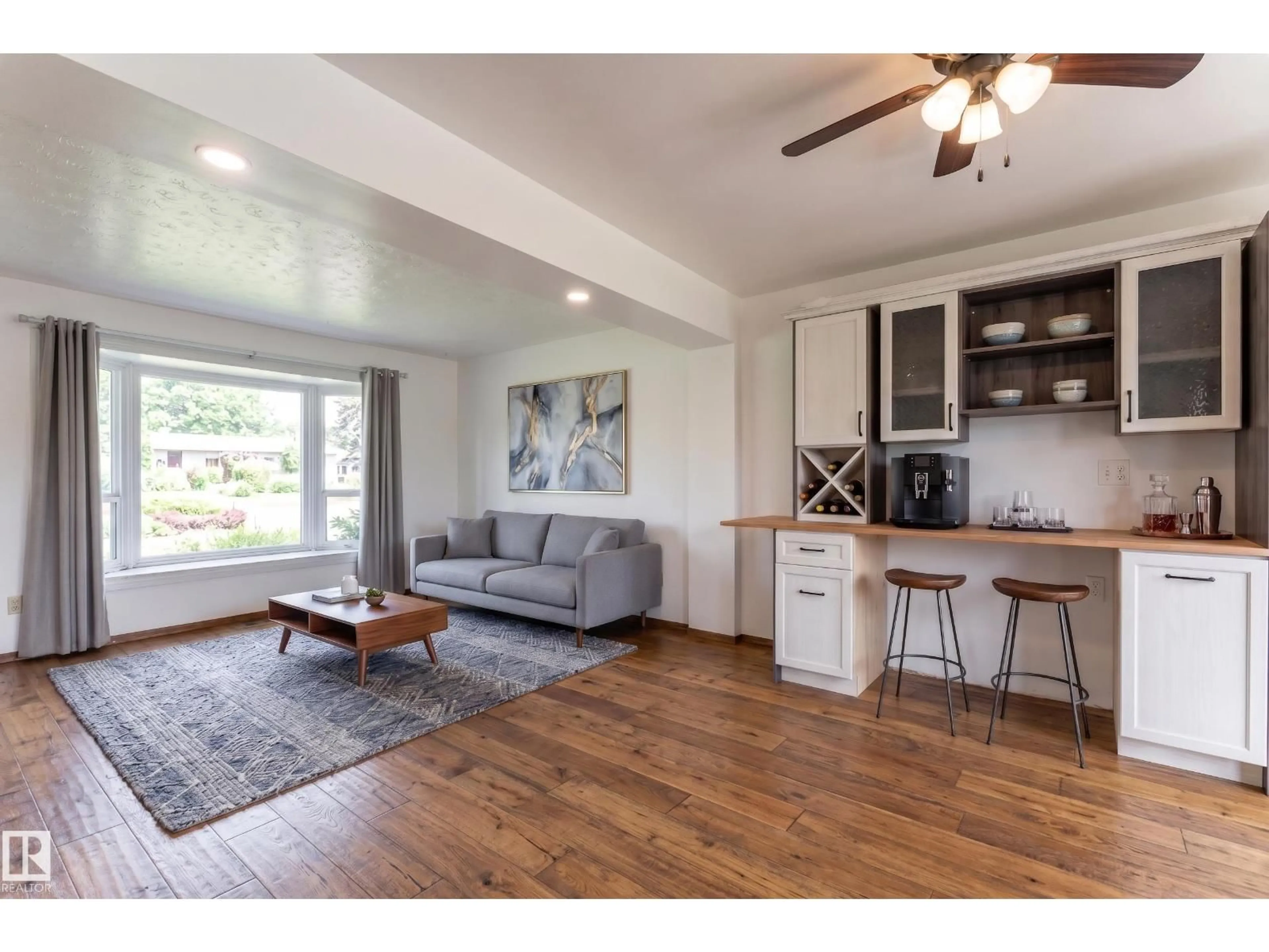 Living room with furniture, wood/laminate floor for NW - 13423 112 ST, Edmonton Alberta T5E5A3