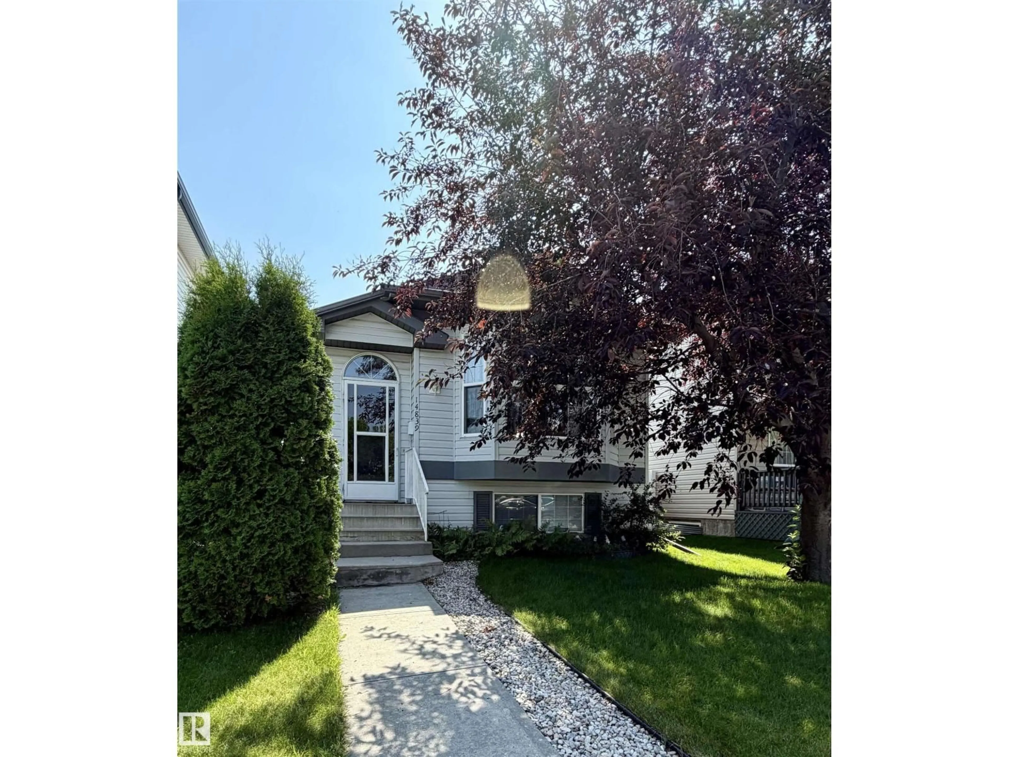 Home with vinyl exterior material, street for 14839 47 ST, Edmonton Alberta T5Y2X3