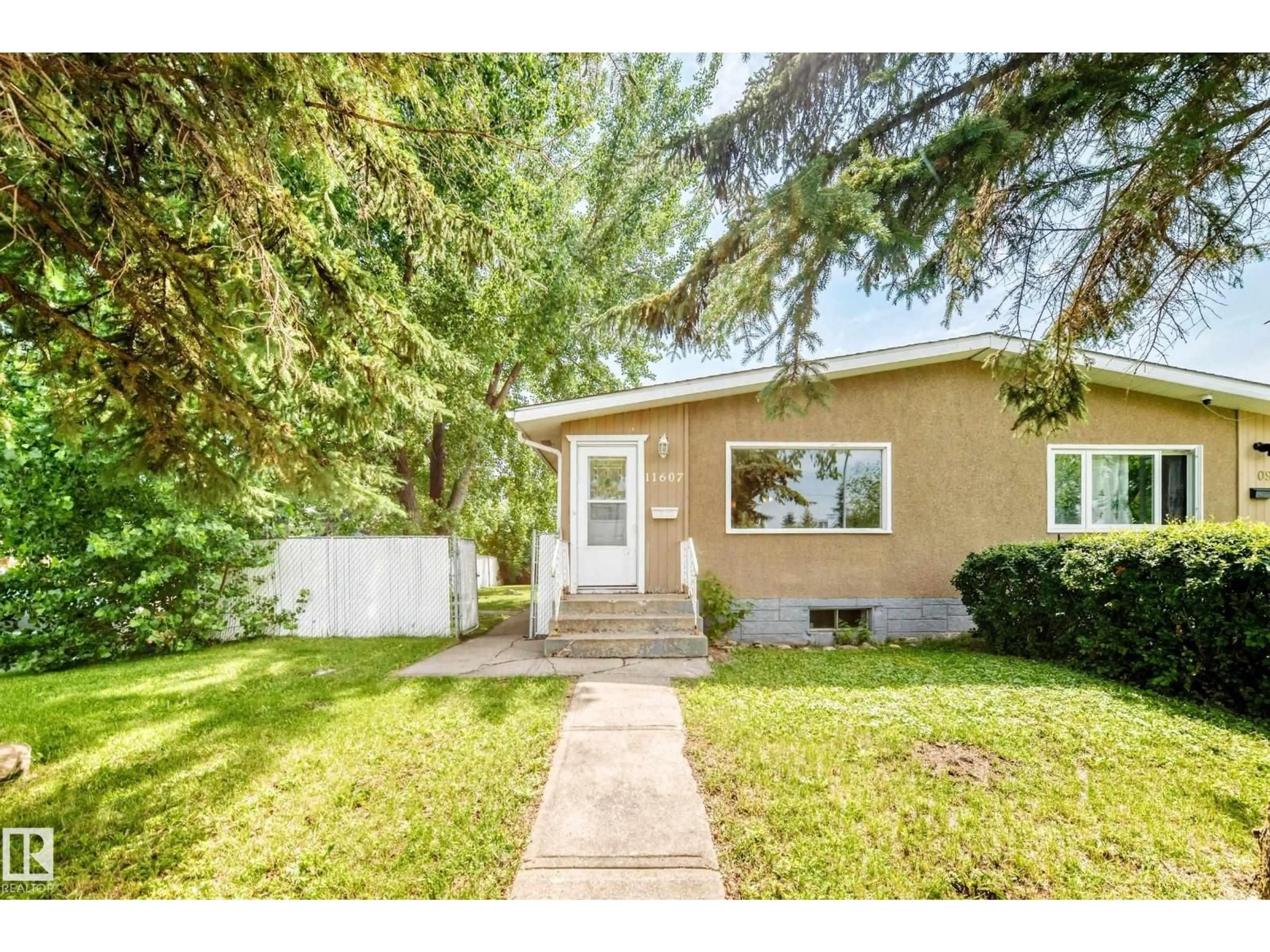 Home with vinyl exterior material, street for 11607 137 AV, Edmonton Alberta T5E1Z6
