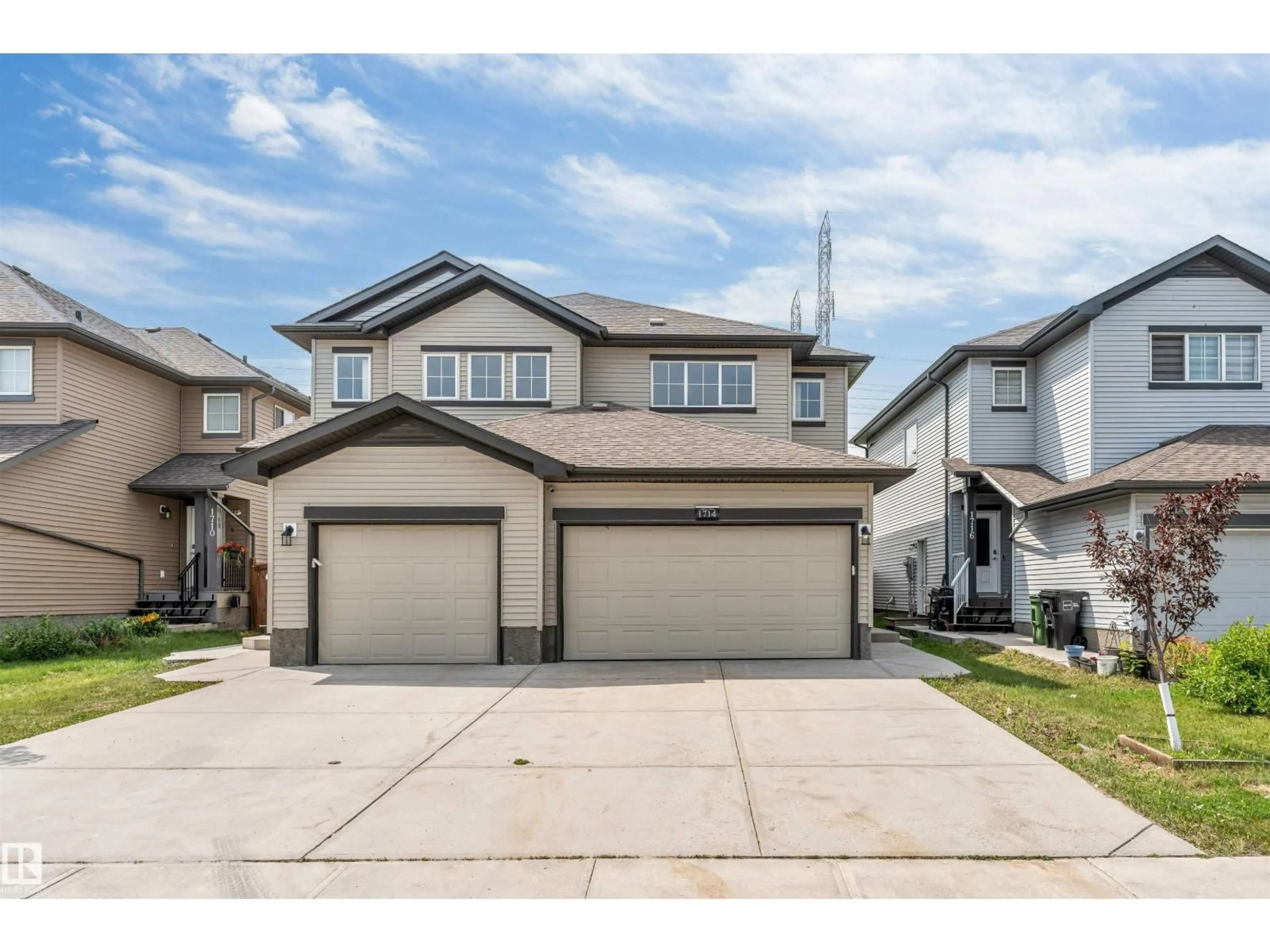 Home with vinyl exterior material, street for 1714 27 ST, Edmonton Alberta T6T2G6
