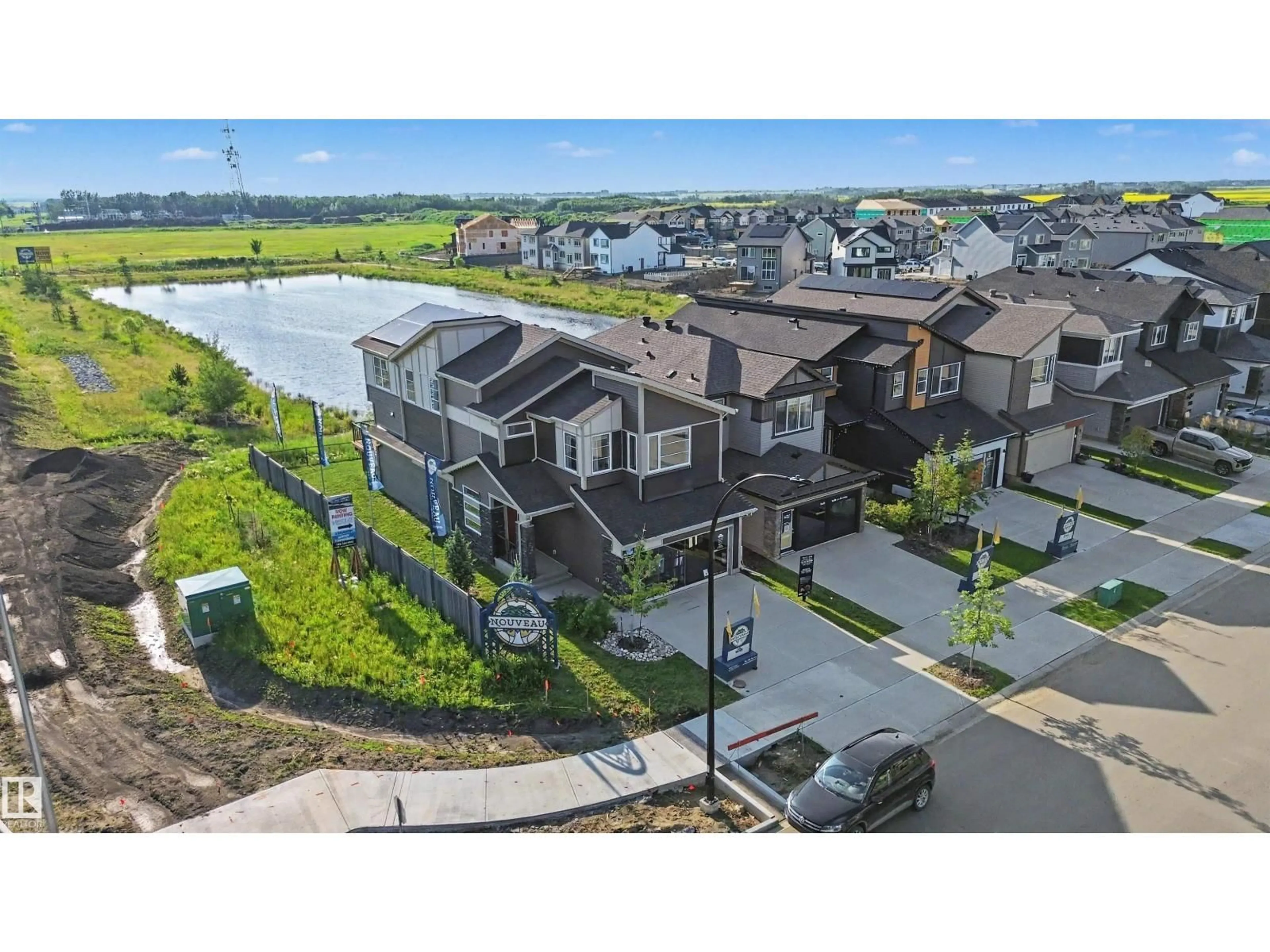 A pic from outside/outdoor area/front of a property/back of a property/a pic from drone, water/lake/river/ocean view for 2 NOUVEAU DR, St. Albert Alberta T8N7Z7