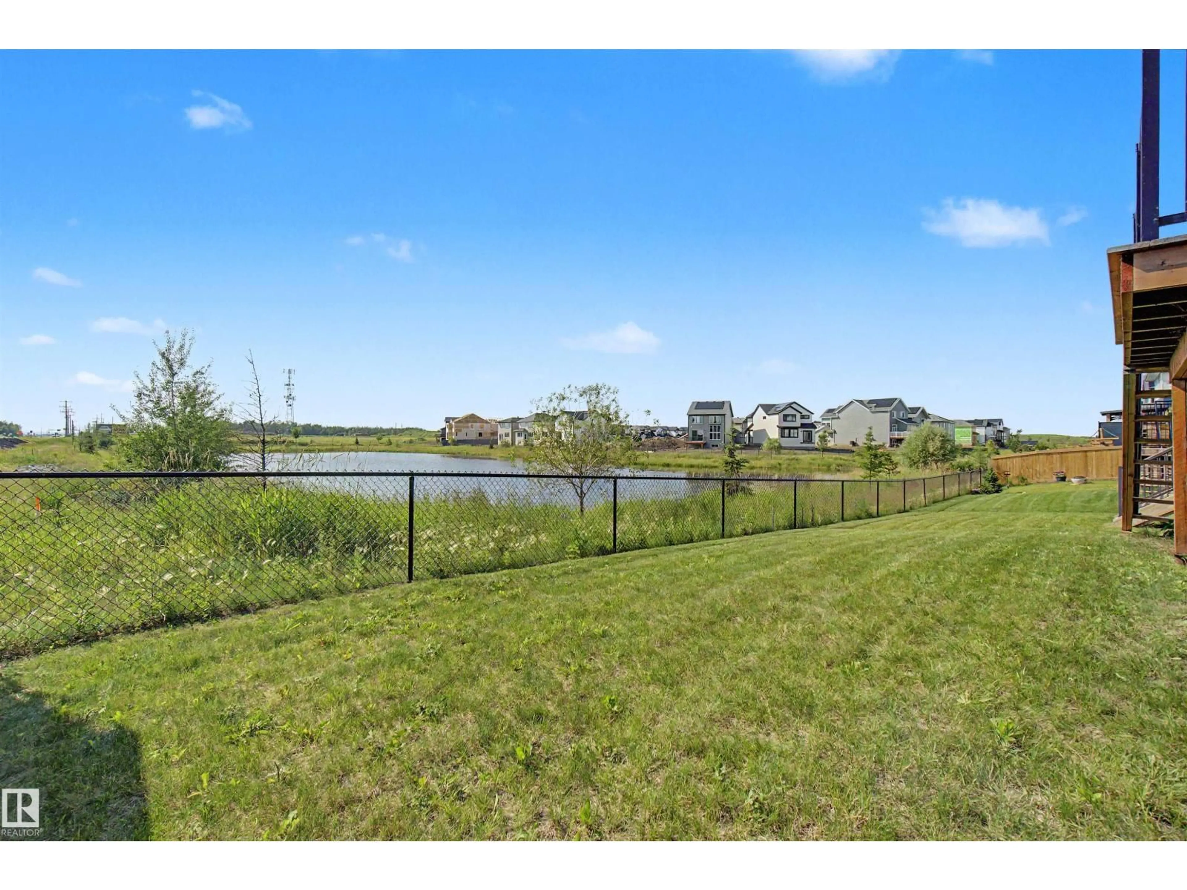 A pic from outside/outdoor area/front of a property/back of a property/a pic from drone, water/lake/river/ocean view for 2 NOUVEAU DR, St. Albert Alberta T8N7Z7