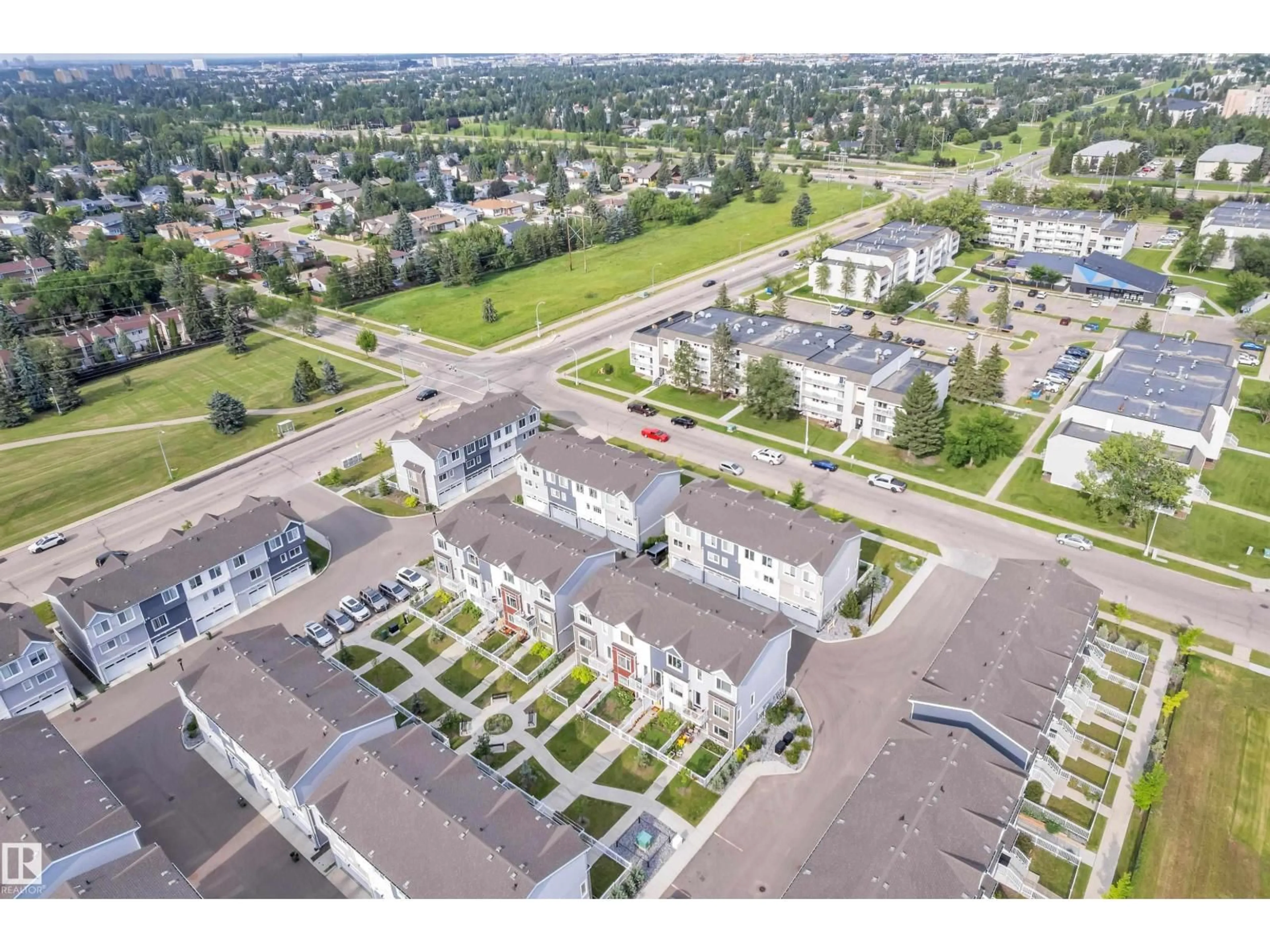 A pic from outside/outdoor area/front of a property/back of a property/a pic from drone, street for 36 215 SADDLEBACK RD, Edmonton Alberta T6J5T6