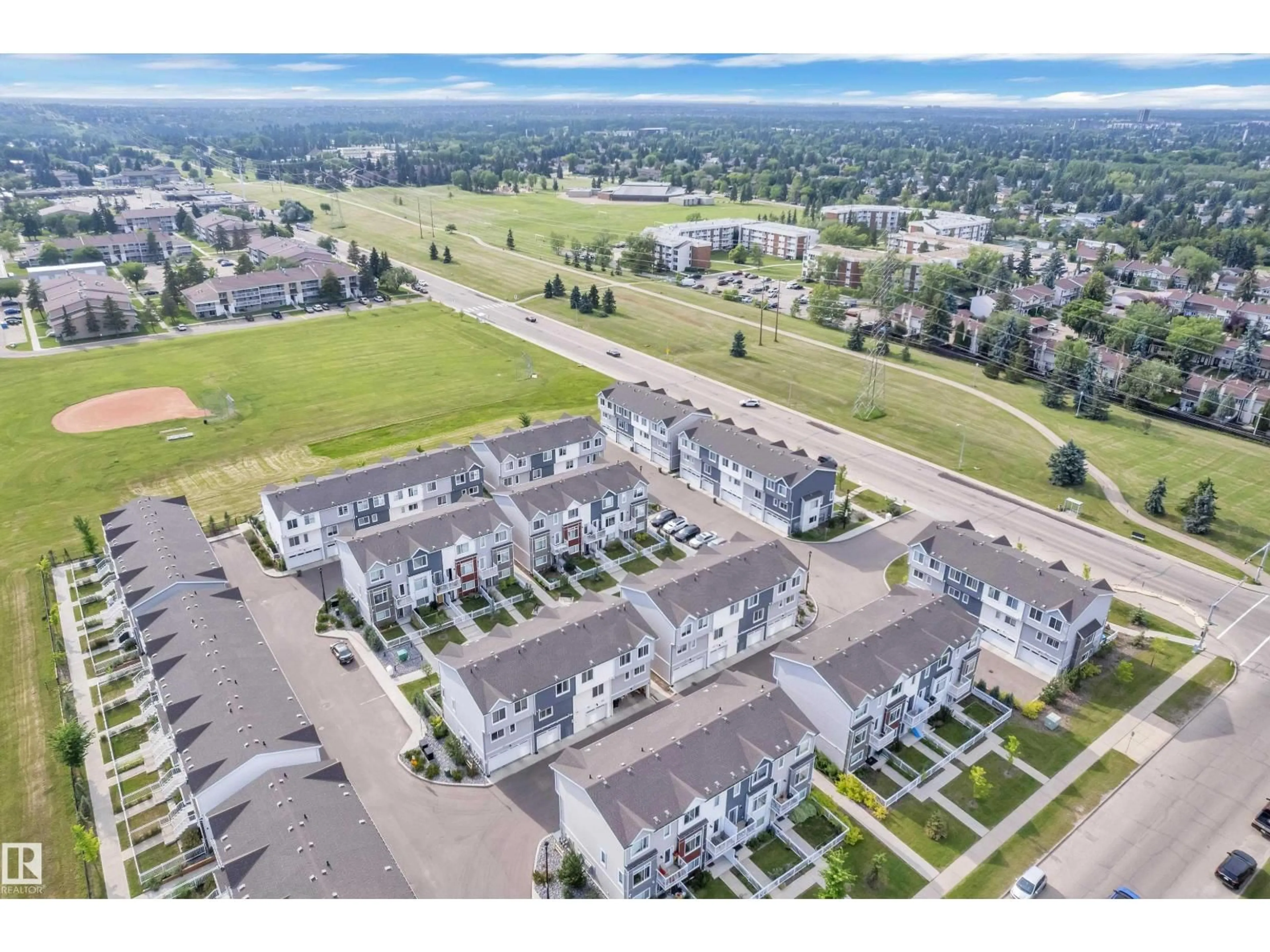 A pic from outside/outdoor area/front of a property/back of a property/a pic from drone, unknown for 36 215 SADDLEBACK RD, Edmonton Alberta T6J5T6