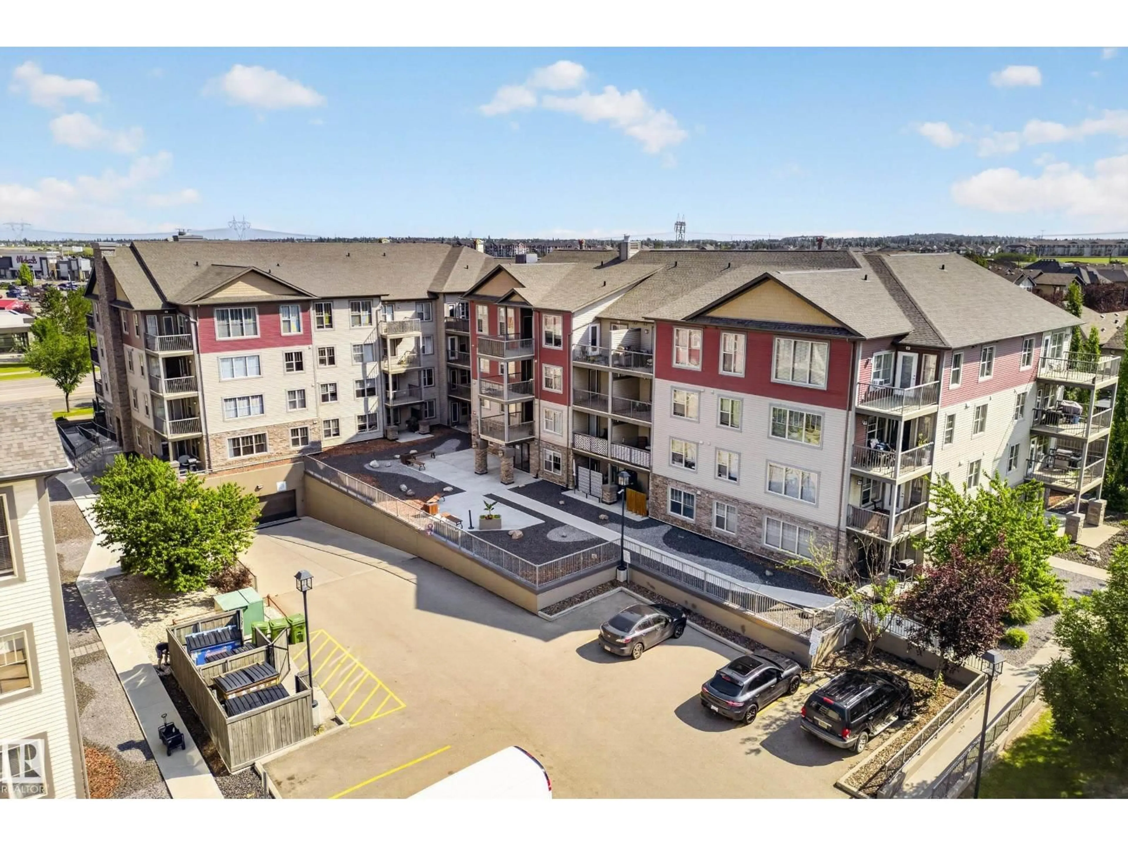 A pic from outside/outdoor area/front of a property/back of a property/a pic from drone, unknown for #406 - 105 AMBLESIDE DR, Edmonton Alberta T6W0J4