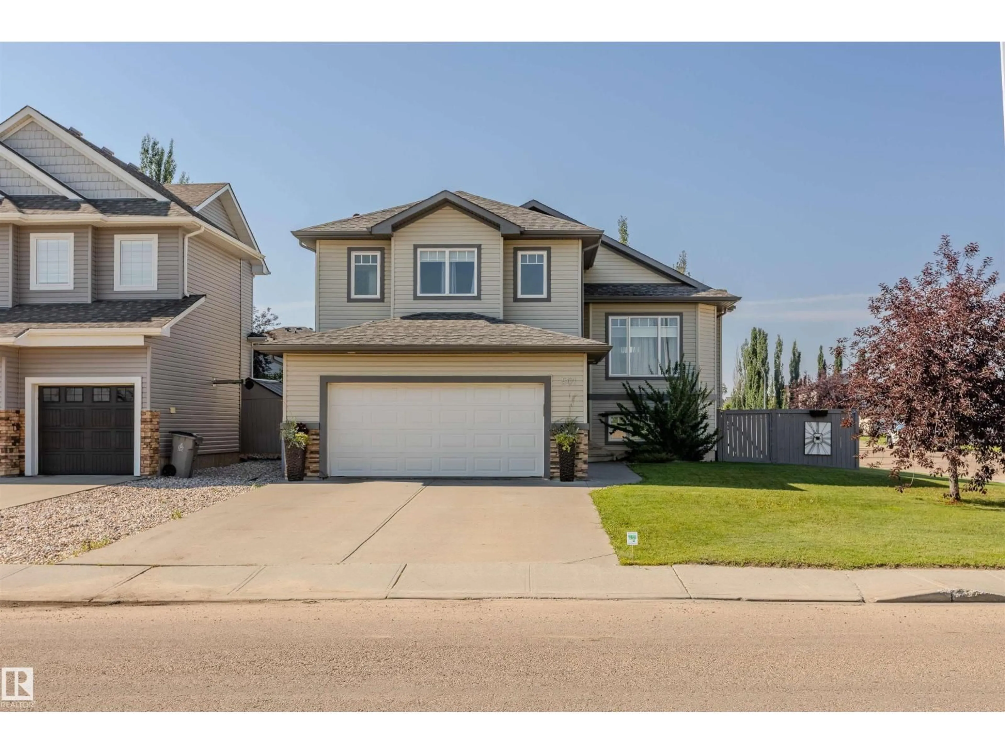 Home with vinyl exterior material, street for 501 GRANDIN DR, Morinville Alberta T8R0E3