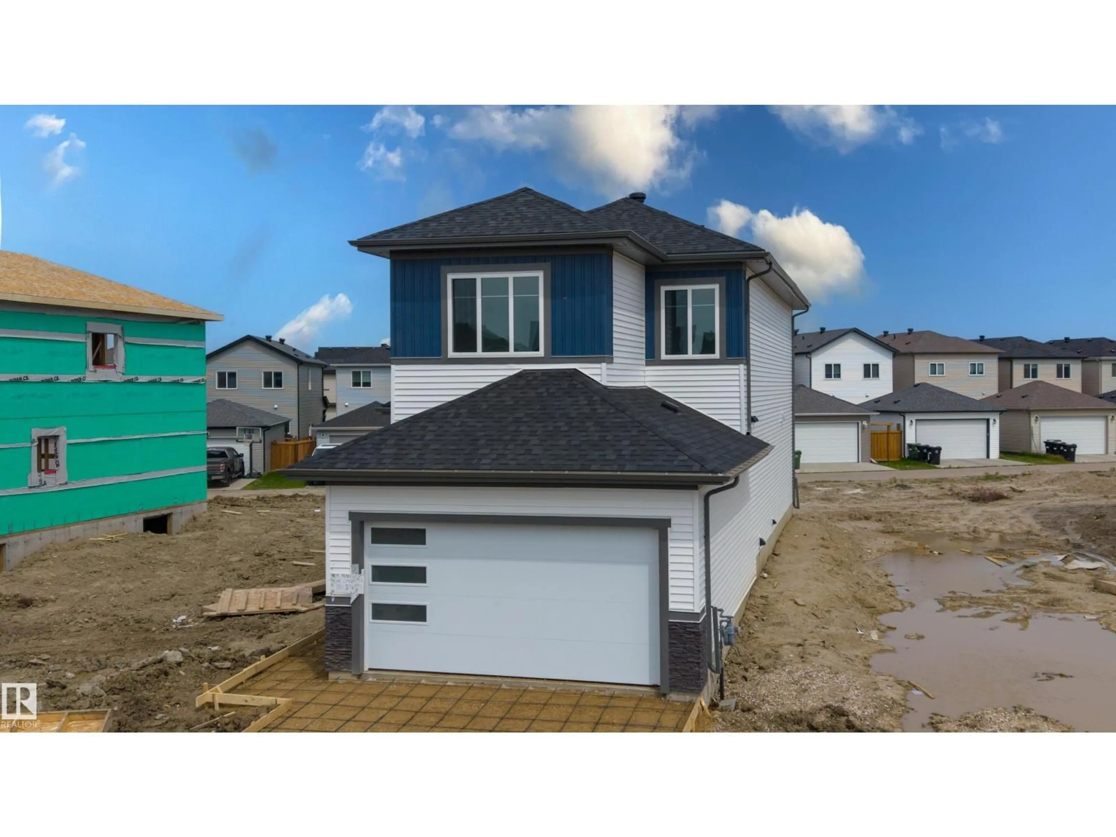 Home with vinyl exterior material, street for 409 MUNN, Leduc Alberta T9E0J9