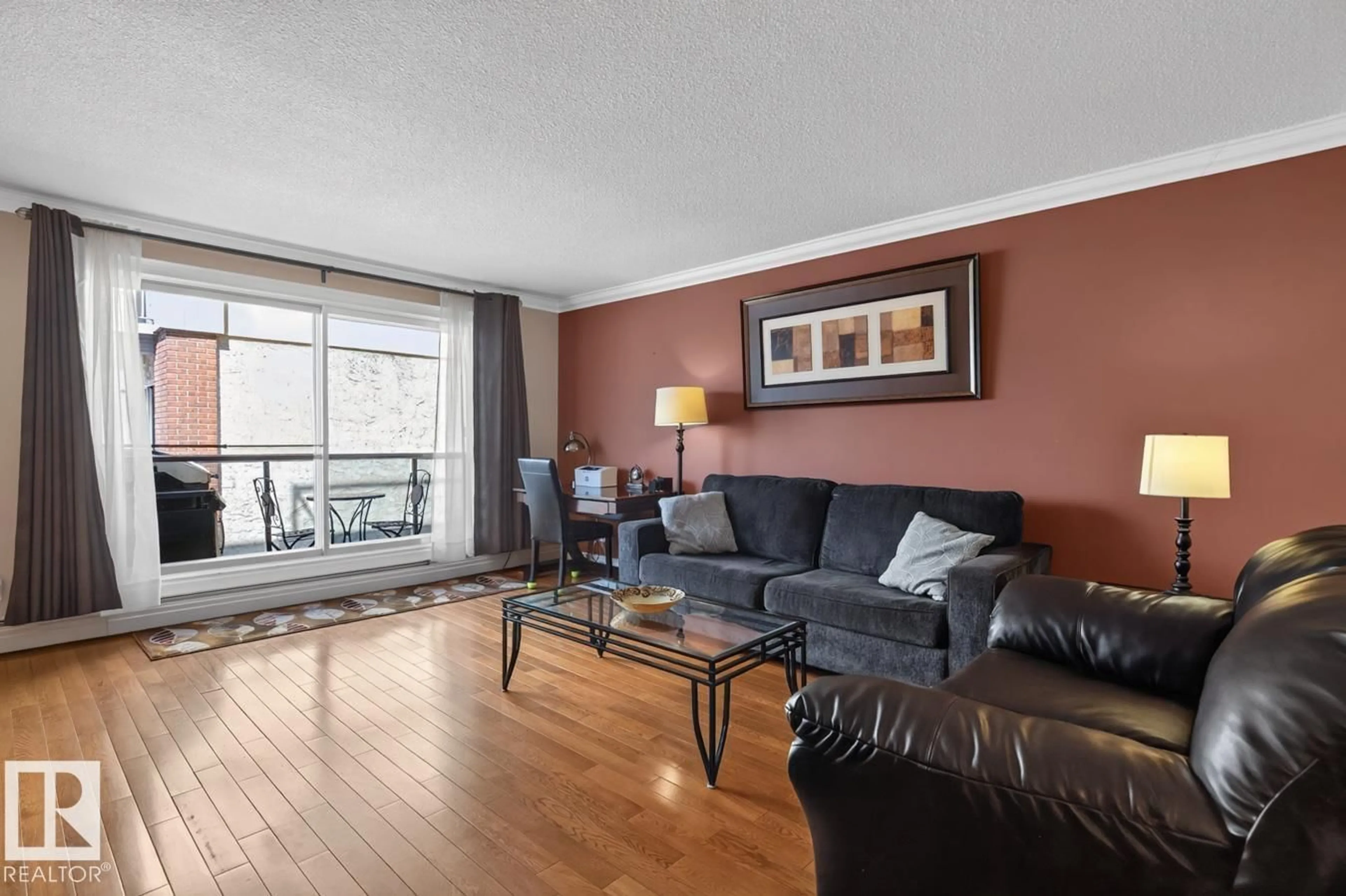 Living room with furniture, wood/laminate floor for #206 - 10745 83 AV, Edmonton Alberta T6E2E5