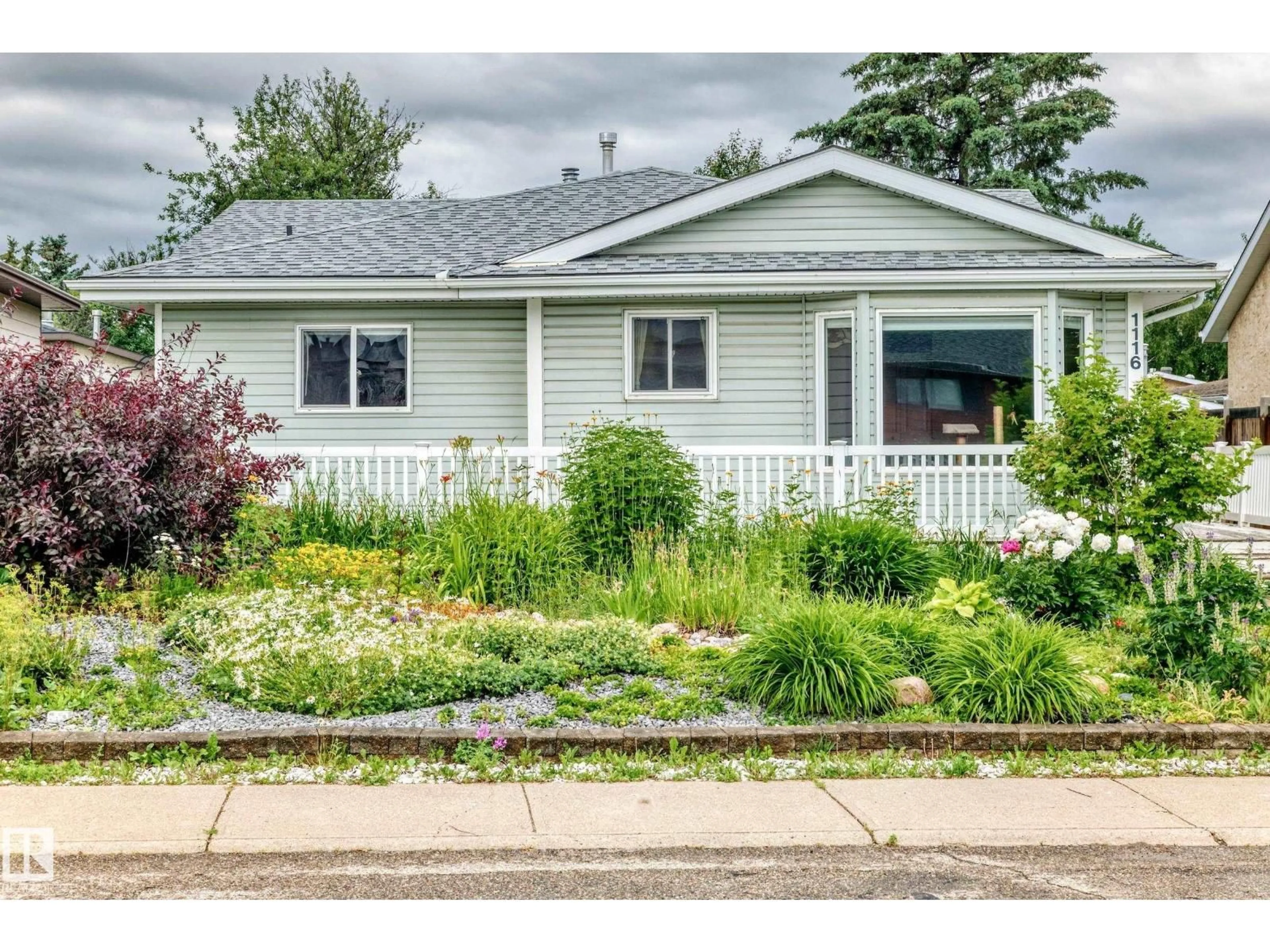 Home with vinyl exterior material, street for NW - 1116 39 ST, Edmonton Alberta T6L2K7