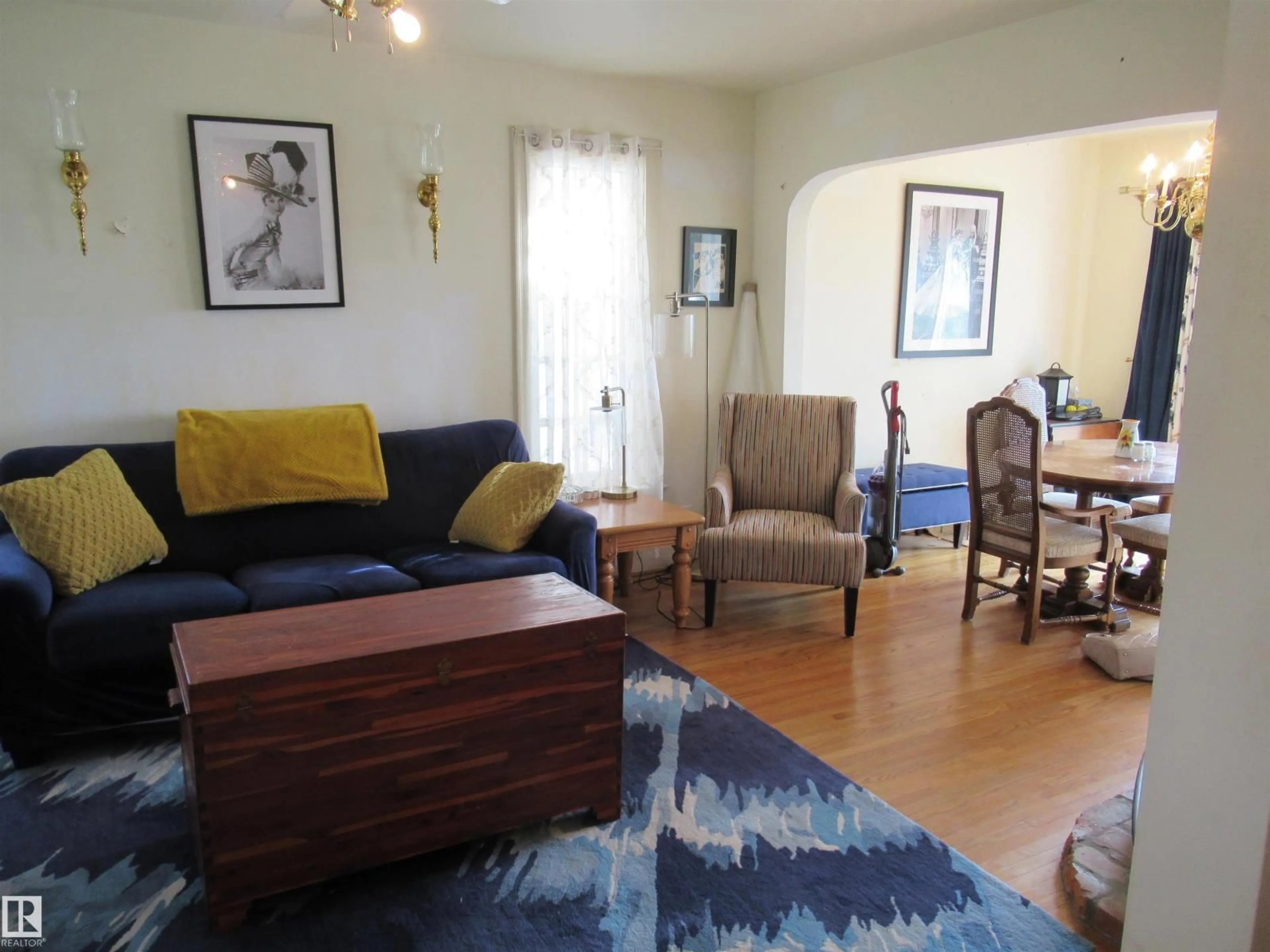 Living room with furniture, wood/laminate floor for 100 ARGENTIA, Rural Wetaskiwin County Alberta T0C2C0