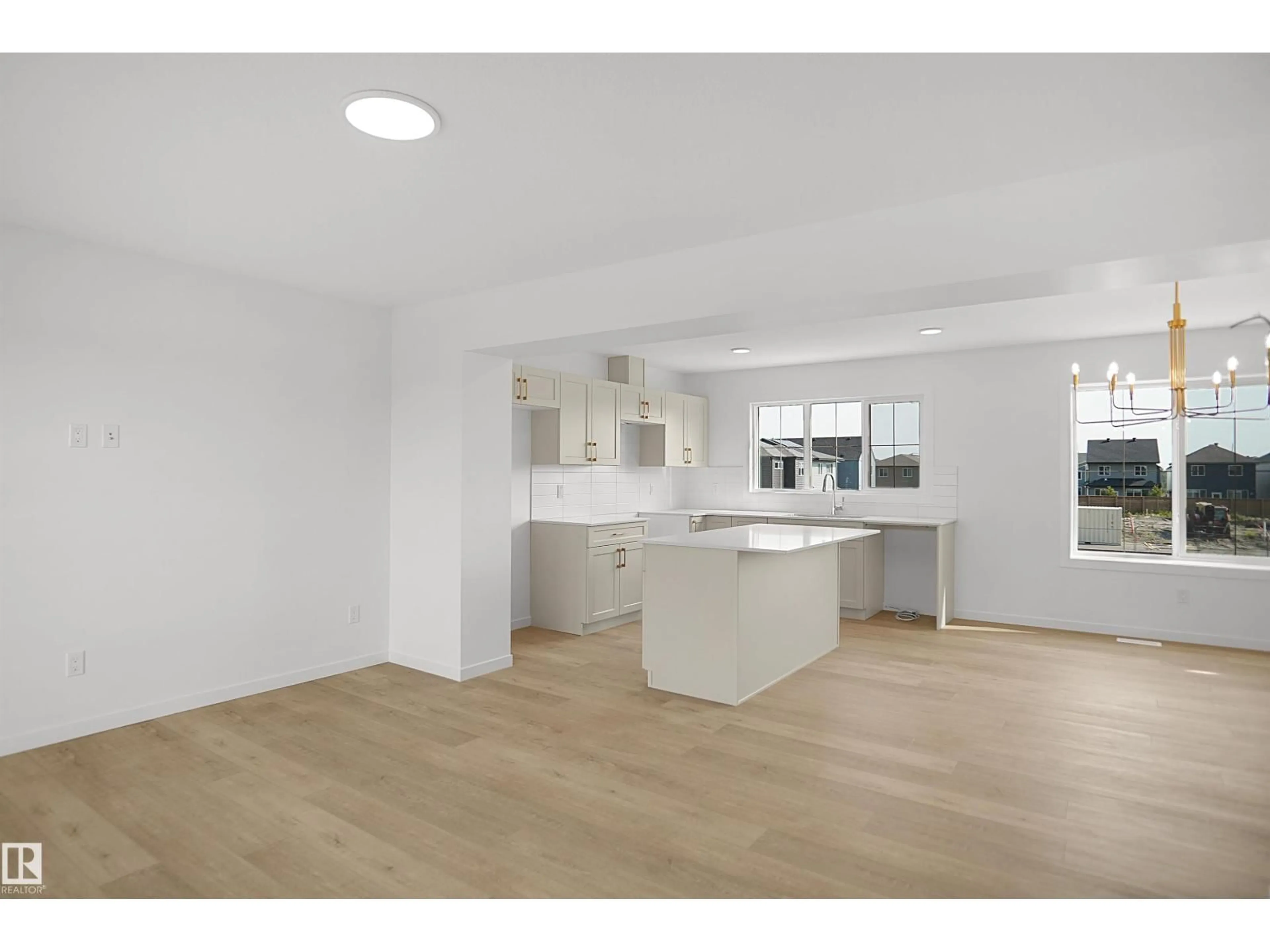 Open concept kitchen, wood/laminate floor for 62 17319 5 ST NE, Edmonton Alberta T5Y4G1