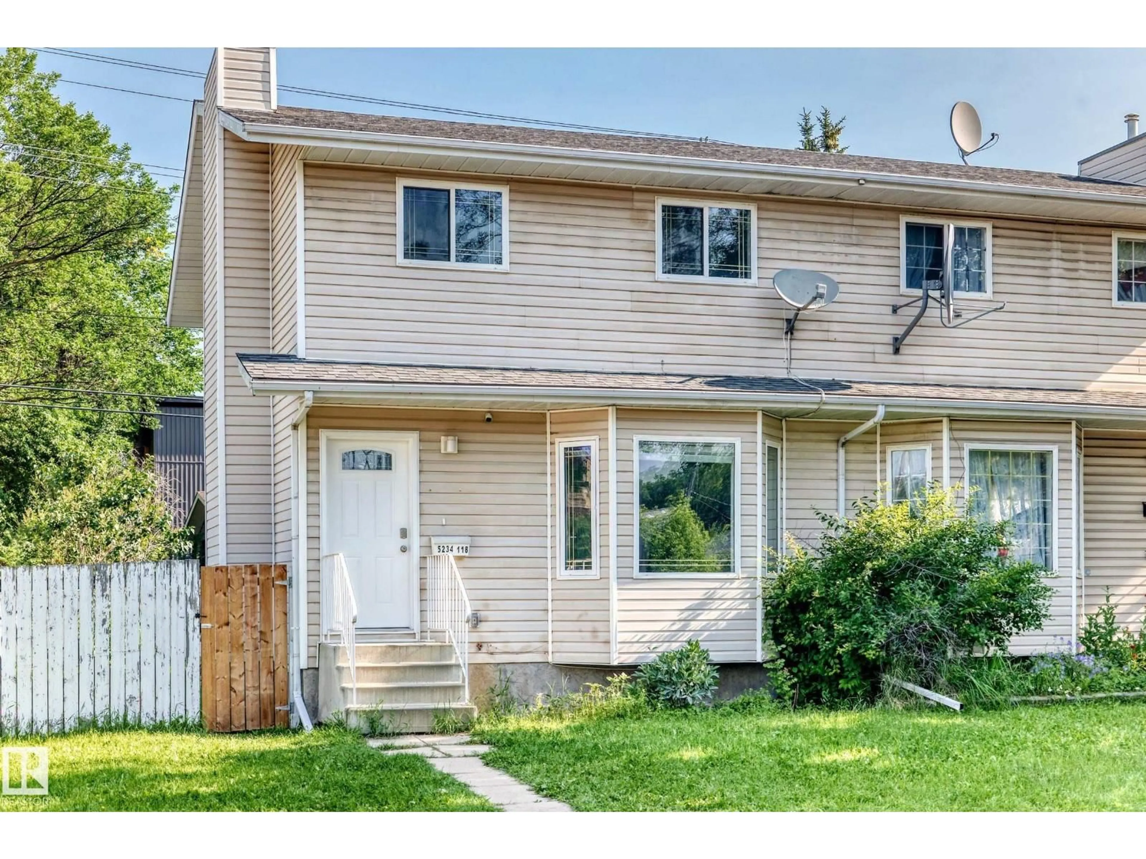 Home with vinyl exterior material, street for 5234 118 AV, Edmonton Alberta T5W1C3
