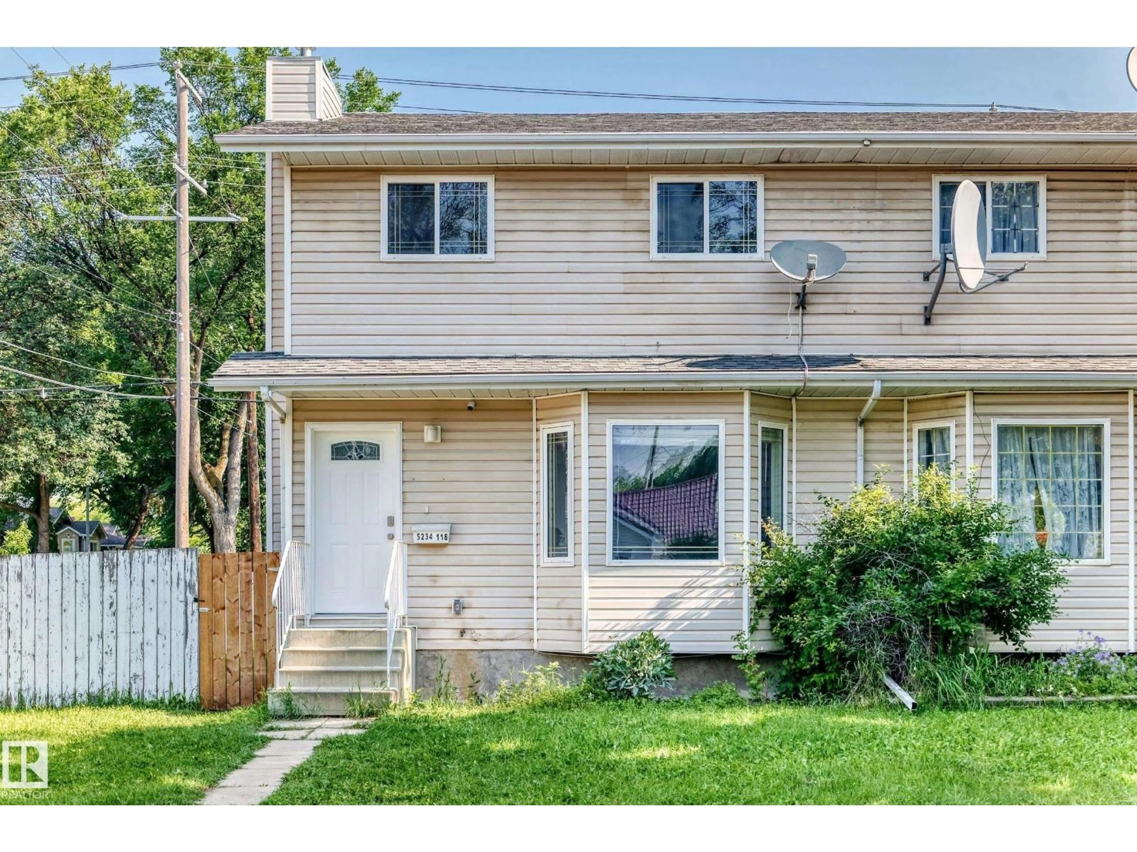 Home with vinyl exterior material, street for 5234 118 AV, Edmonton Alberta T5W1C3