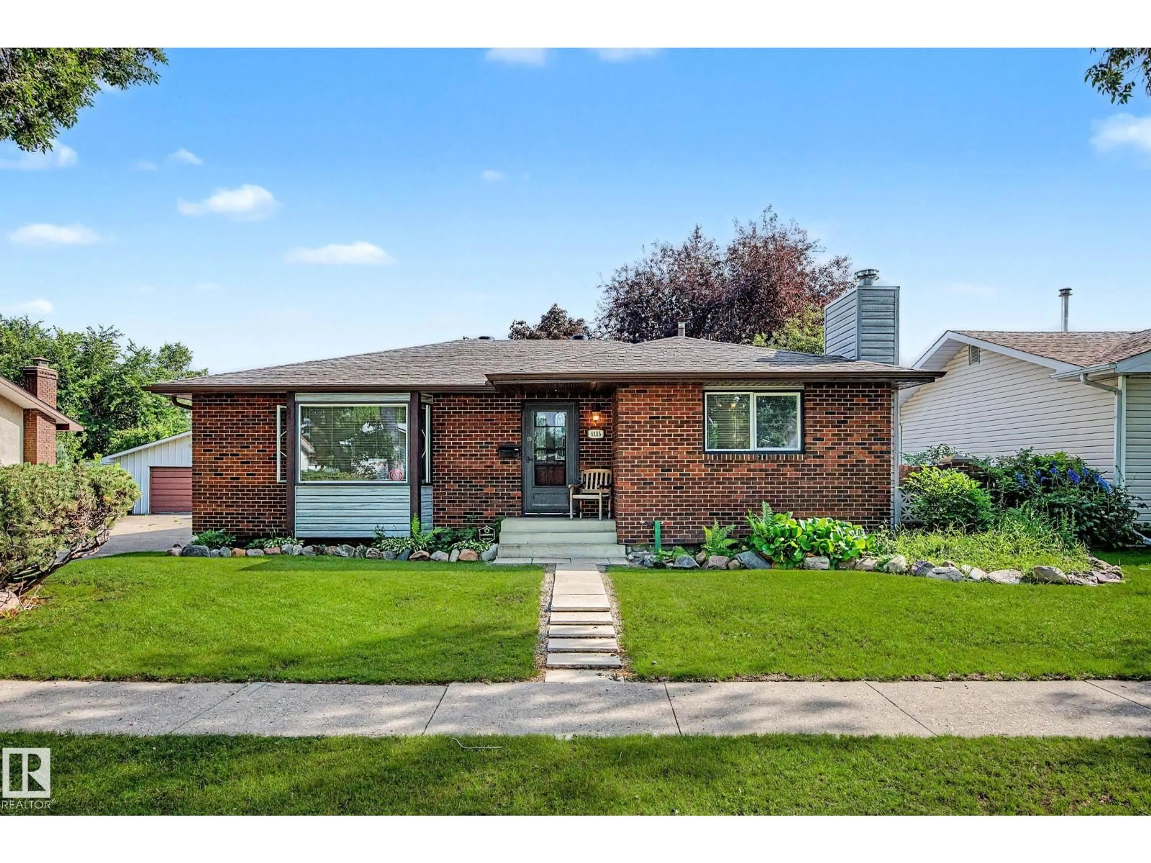 Home with brick exterior material, street for 6115 152A AV, Edmonton Alberta T5A1X9