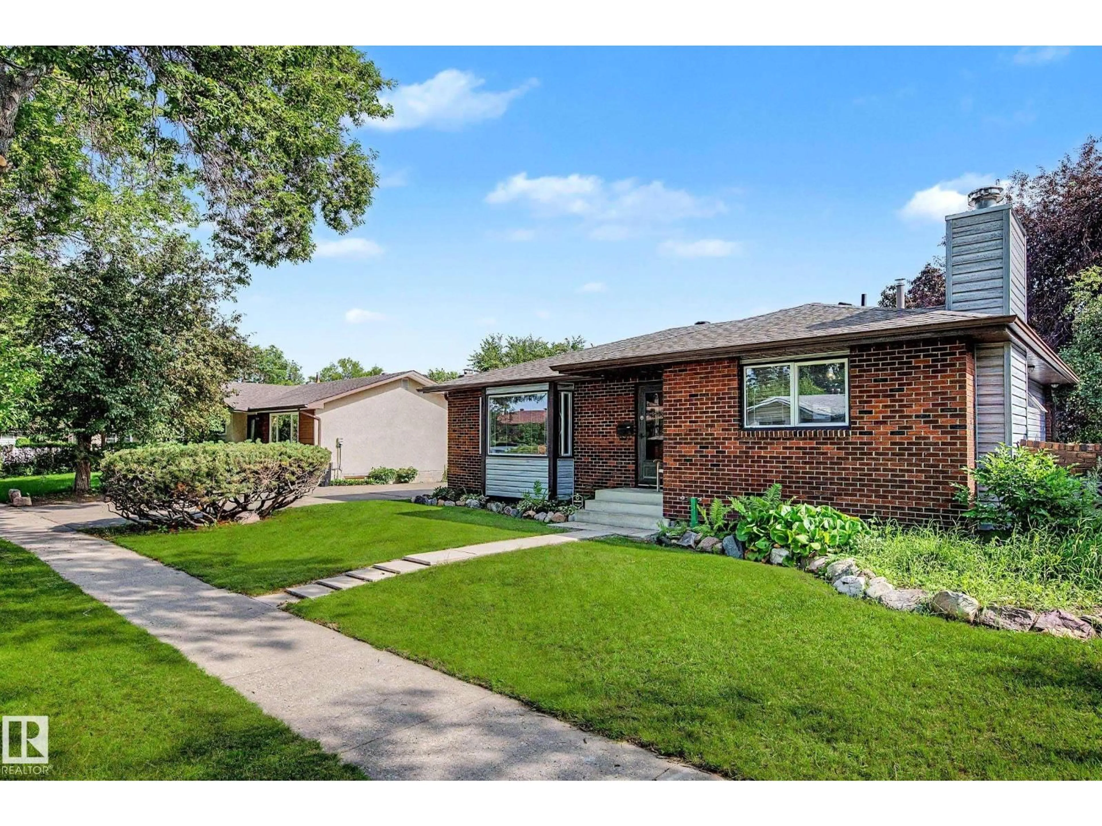 Home with brick exterior material, street for 6115 152A AV, Edmonton Alberta T5A1X9