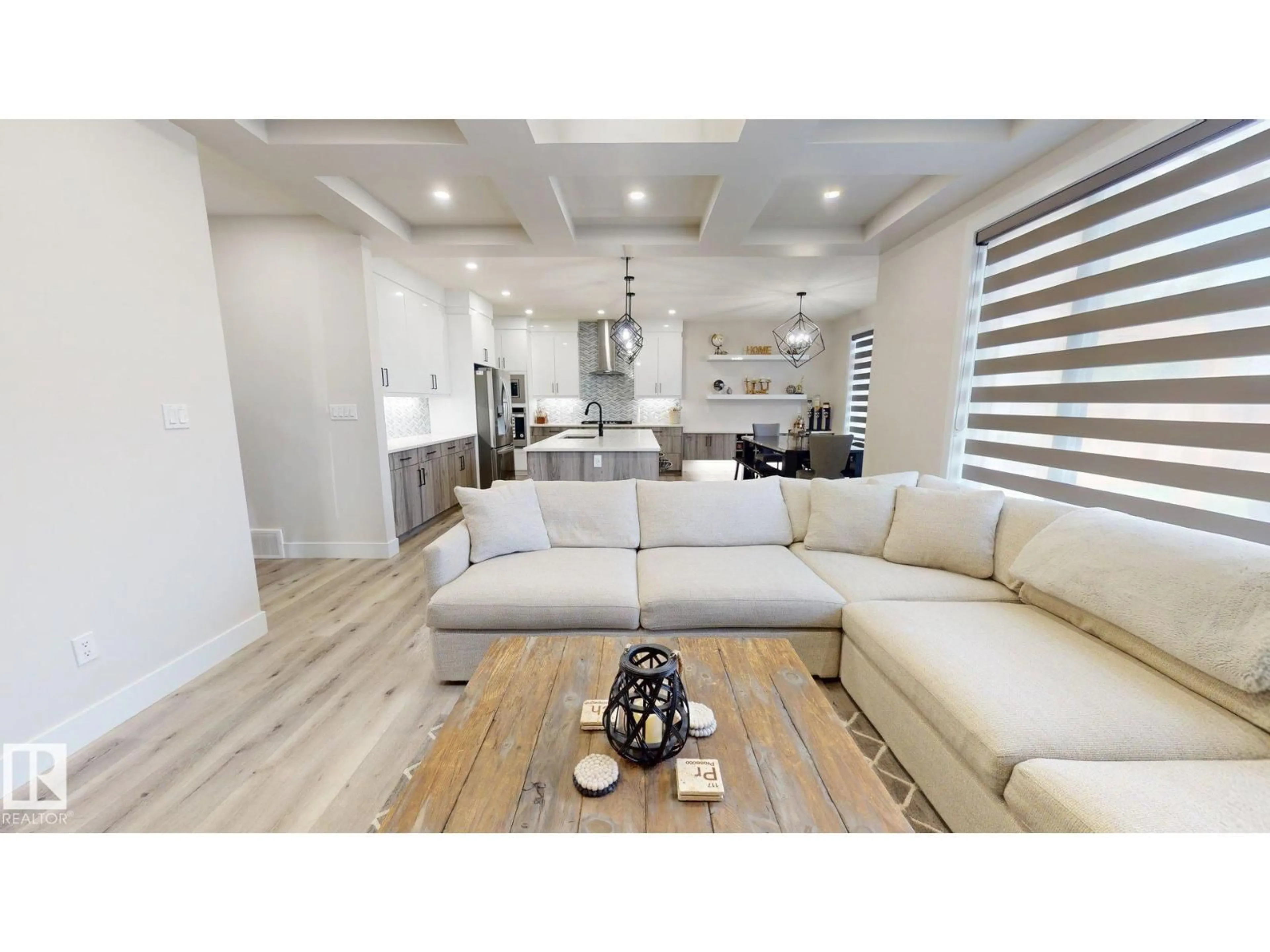 Living room with furniture, wood/laminate floor for 5813 PELERIN CR, Beaumont Alberta T4X2X8