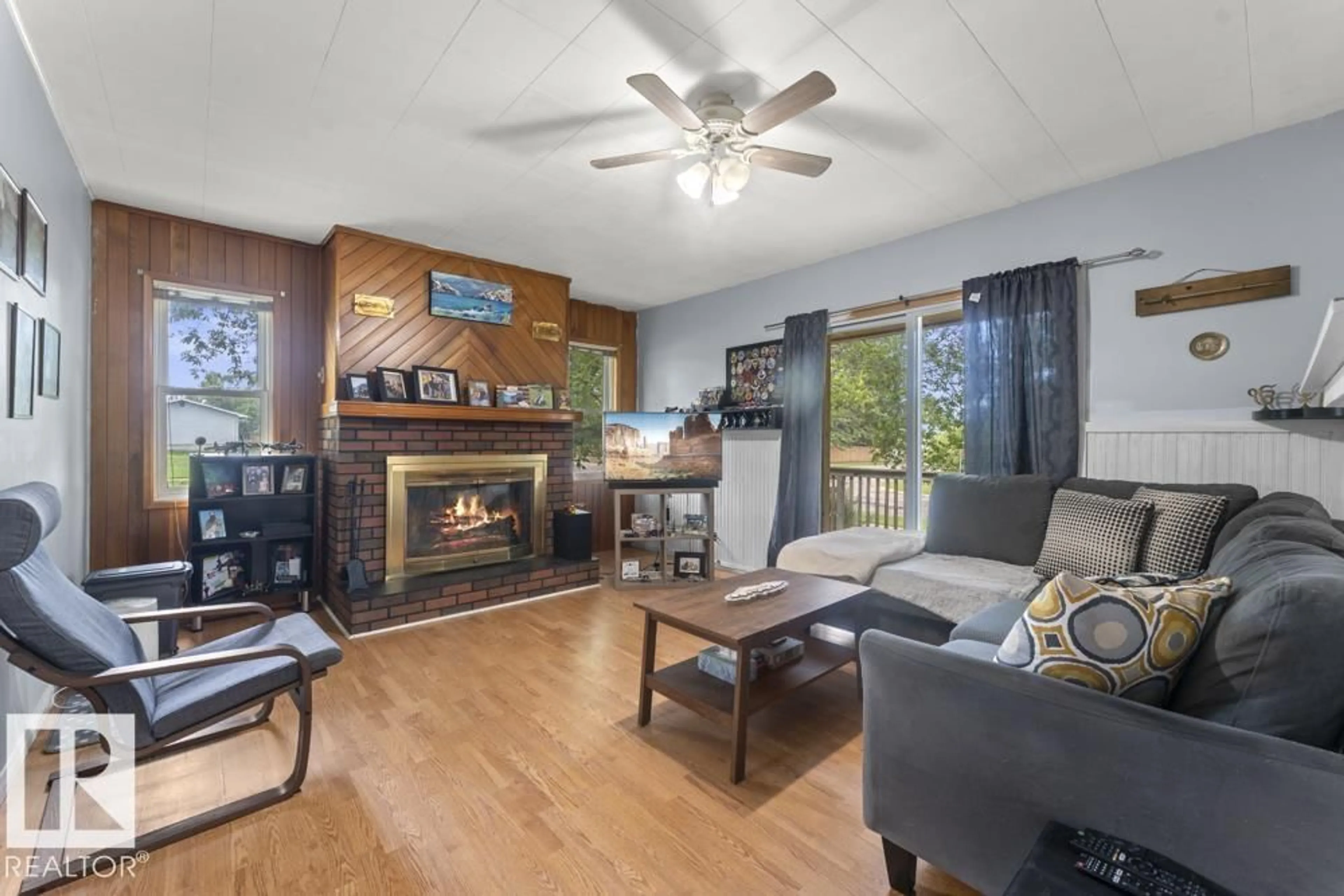 Living room with furniture, wood/laminate floor for 5201 58 ST, Cold Lake Alberta T9M1S3