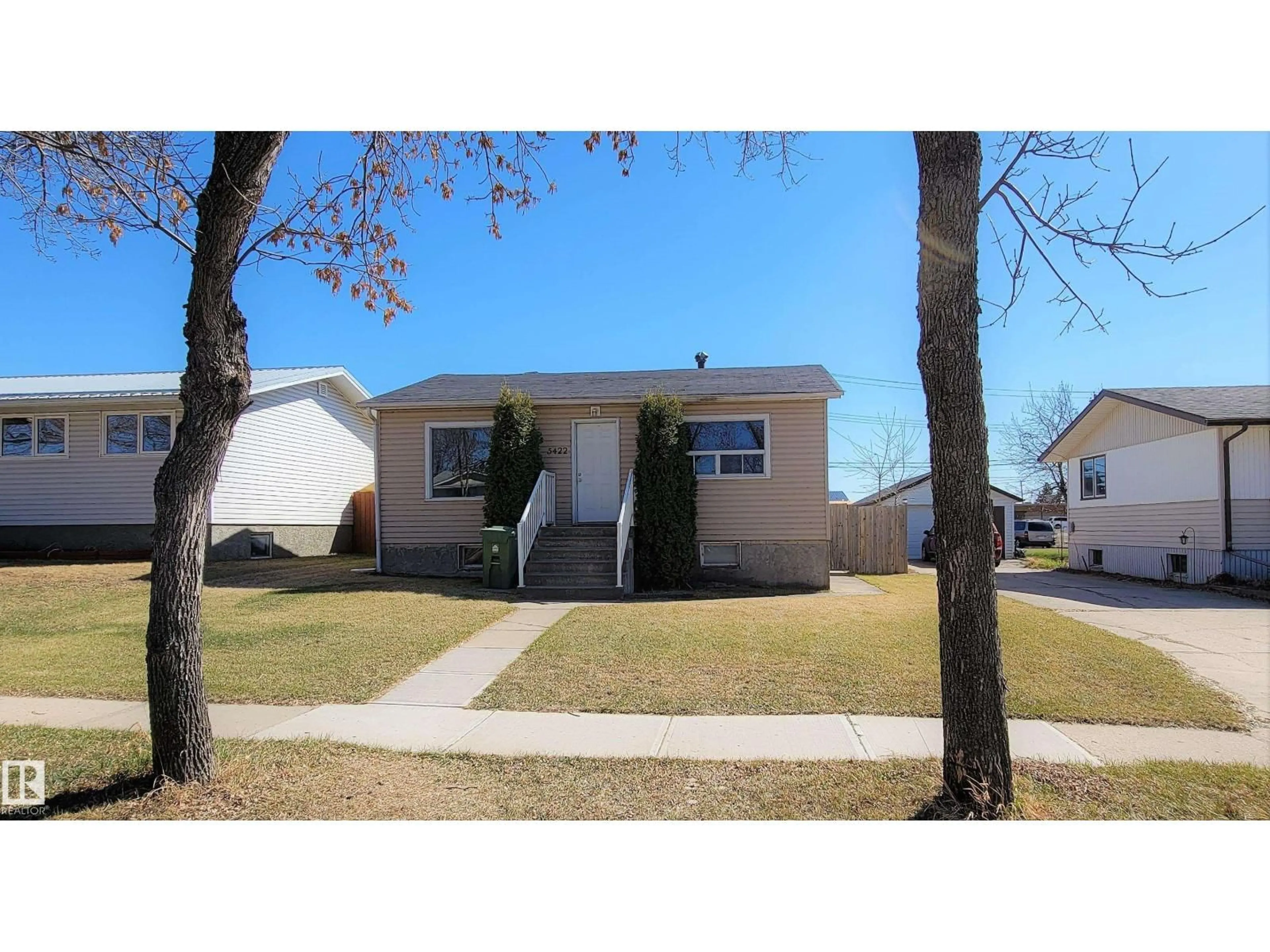 Home with vinyl exterior material, street for 5422 51 AV, Bonnyville Town Alberta T9N1Z8
