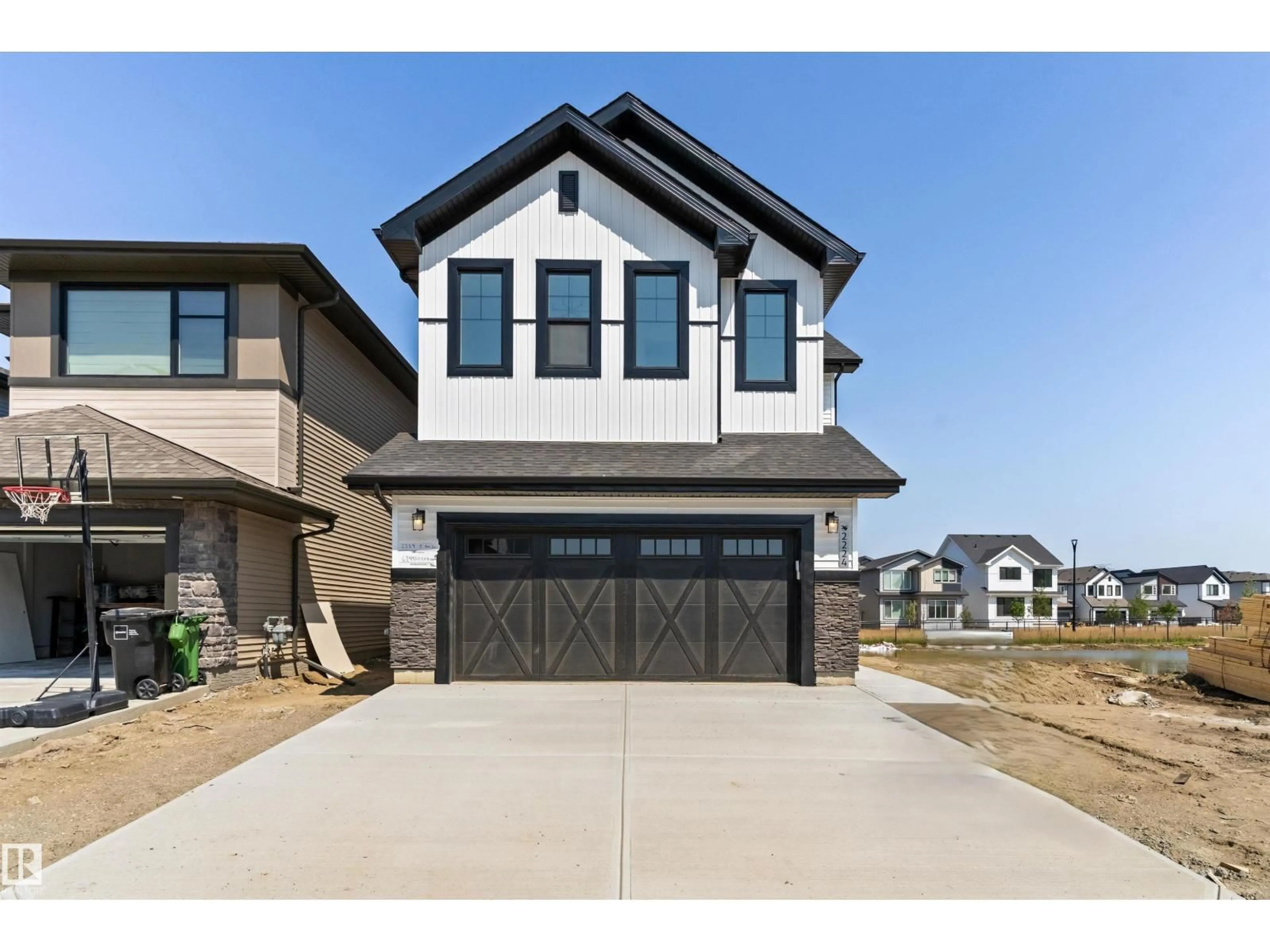 Home with brick exterior material, street for 2224 5 AV, Edmonton Alberta T6X3L8