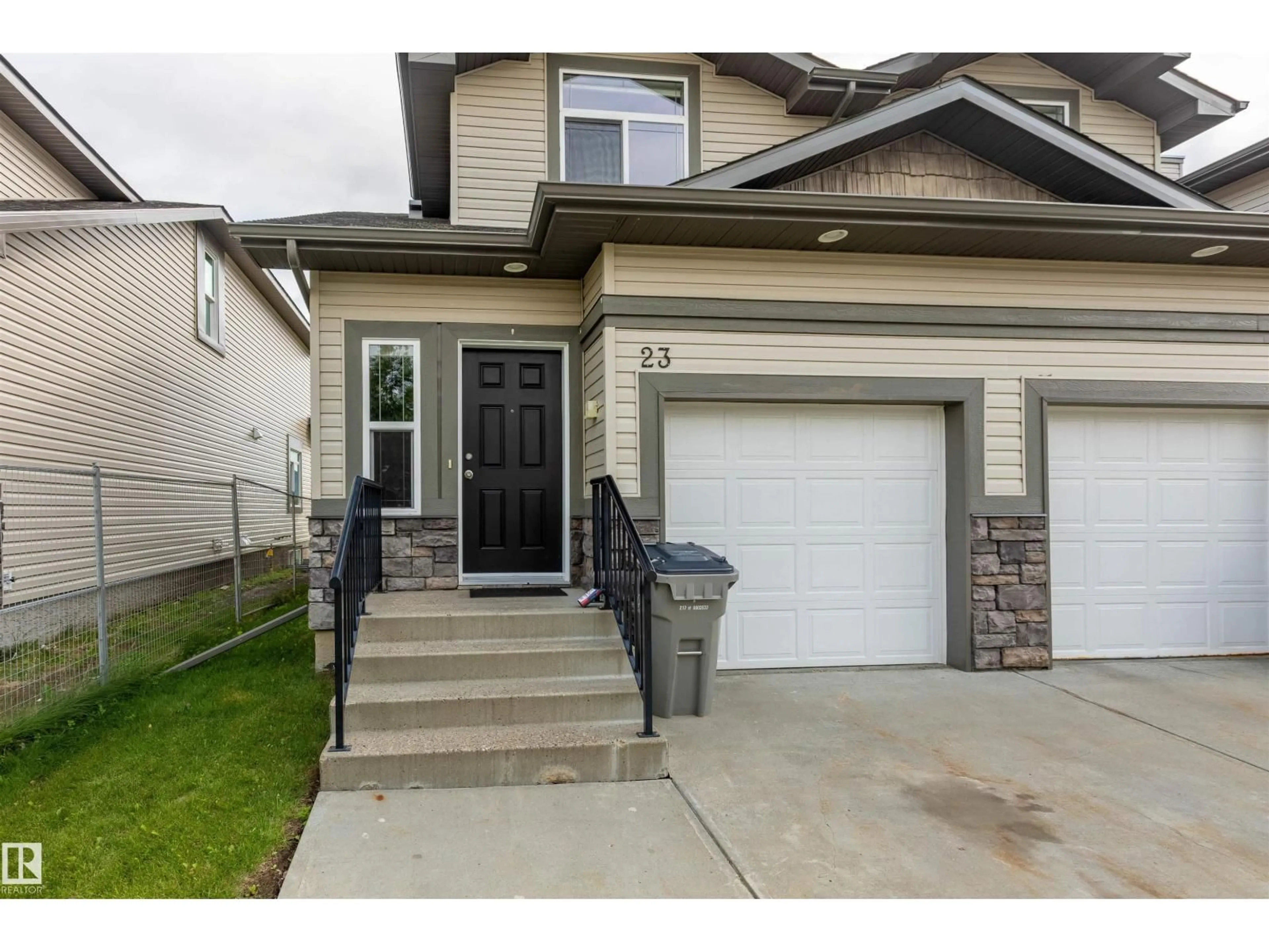Home with vinyl exterior material, street for 23 - 9511 102, Morinville Alberta T8R0C6