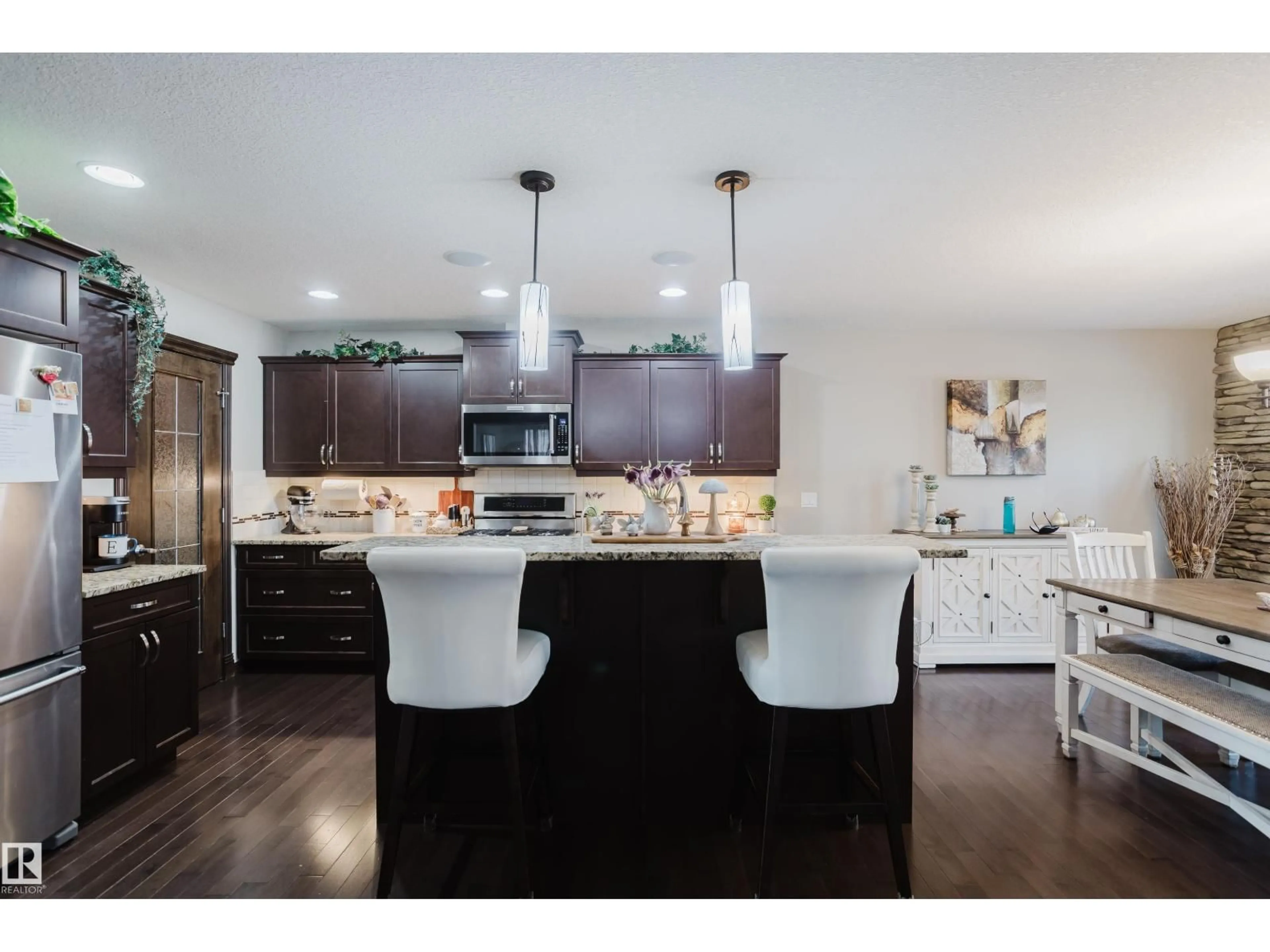 Open concept kitchen, wood/laminate floor for 9729 159 ST, Edmonton Alberta T5P2Z4