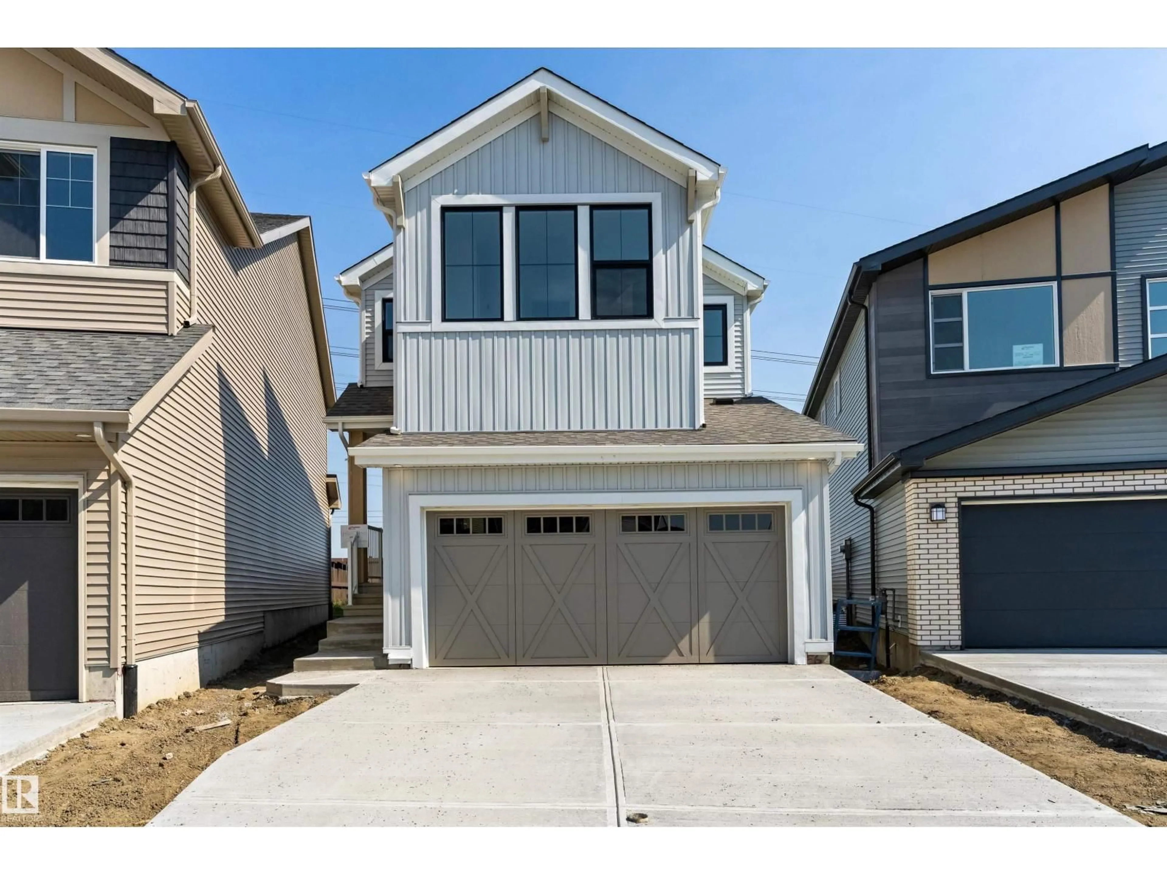 Home with vinyl exterior material, street for NW - 18808 29 AV, Edmonton Alberta T6M3C5