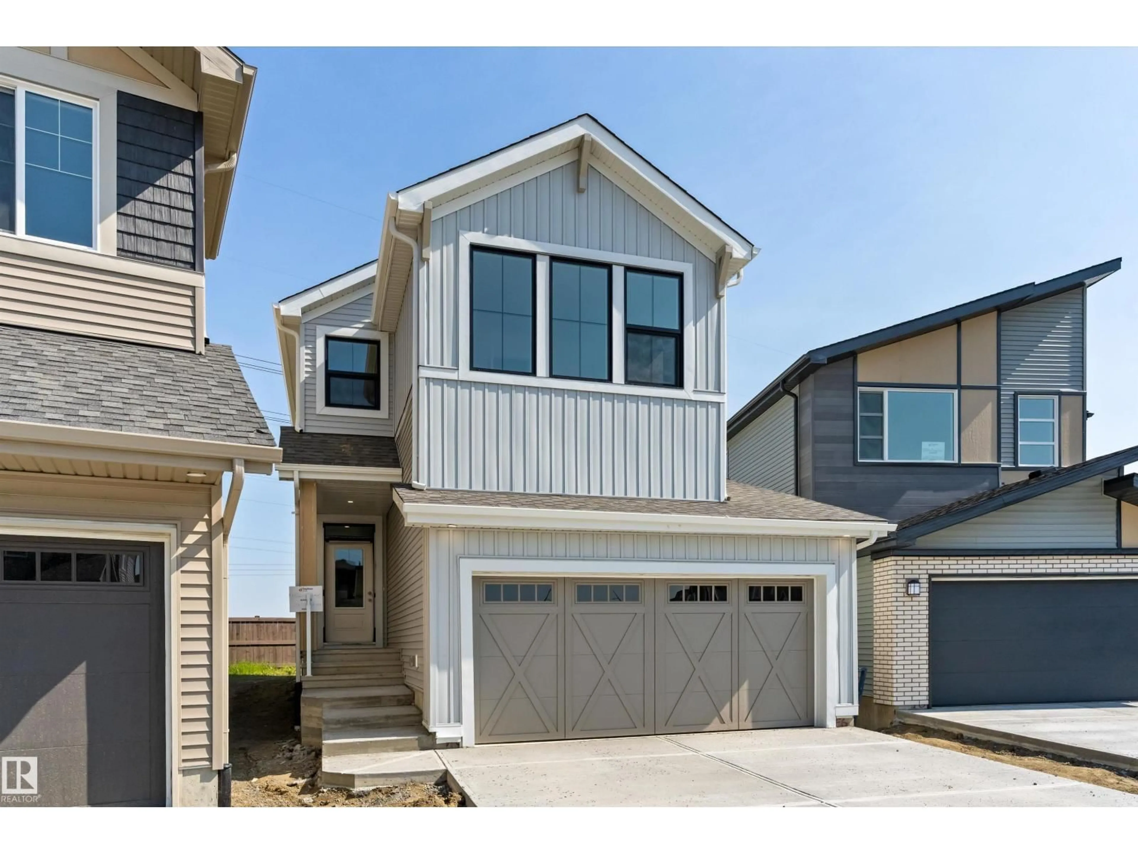 Home with vinyl exterior material, street for NW - 18808 29 AV, Edmonton Alberta T6M3C5