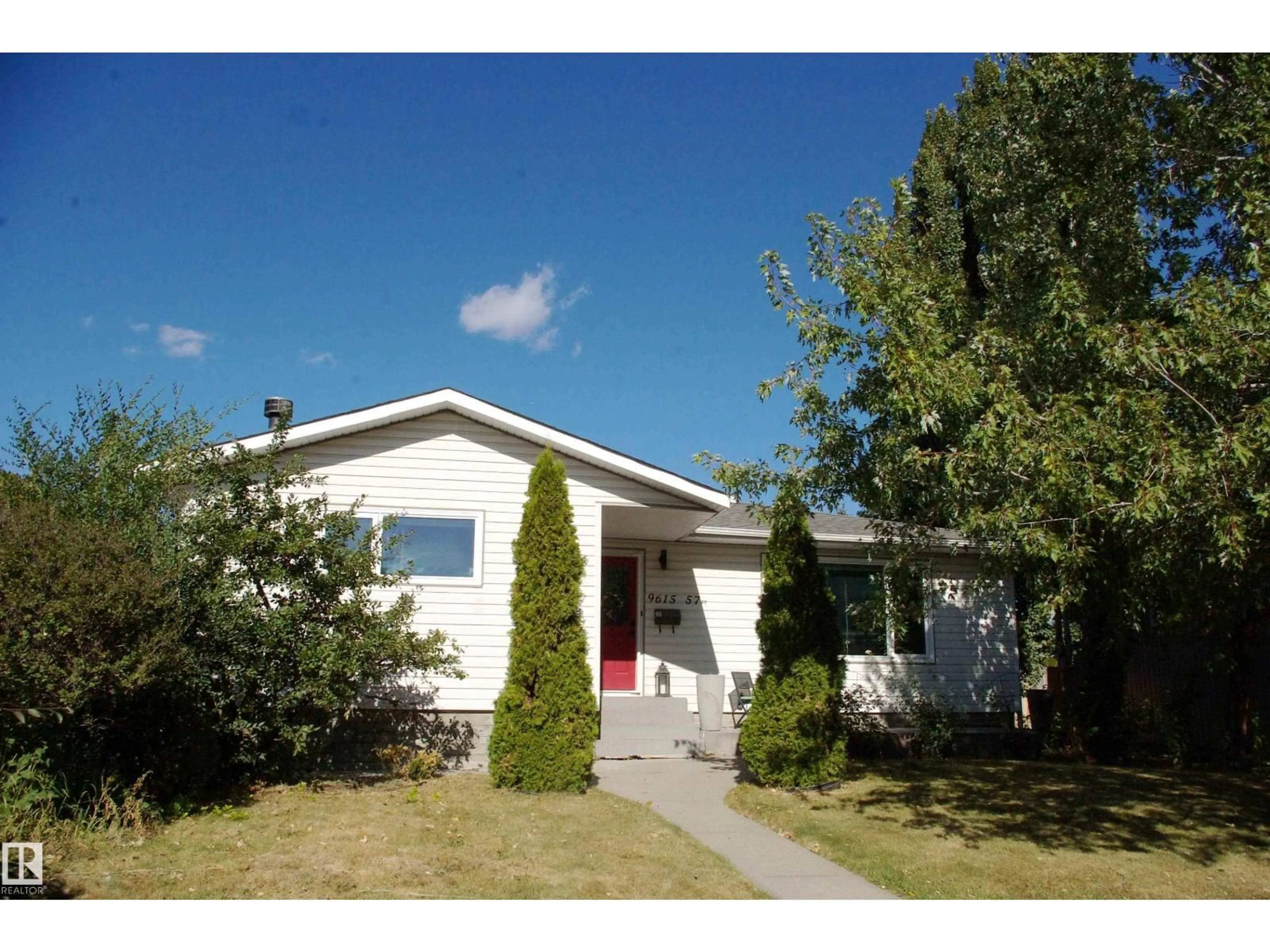 Home with vinyl exterior material, street for 9615 57 ST, Edmonton Alberta T6B1J8