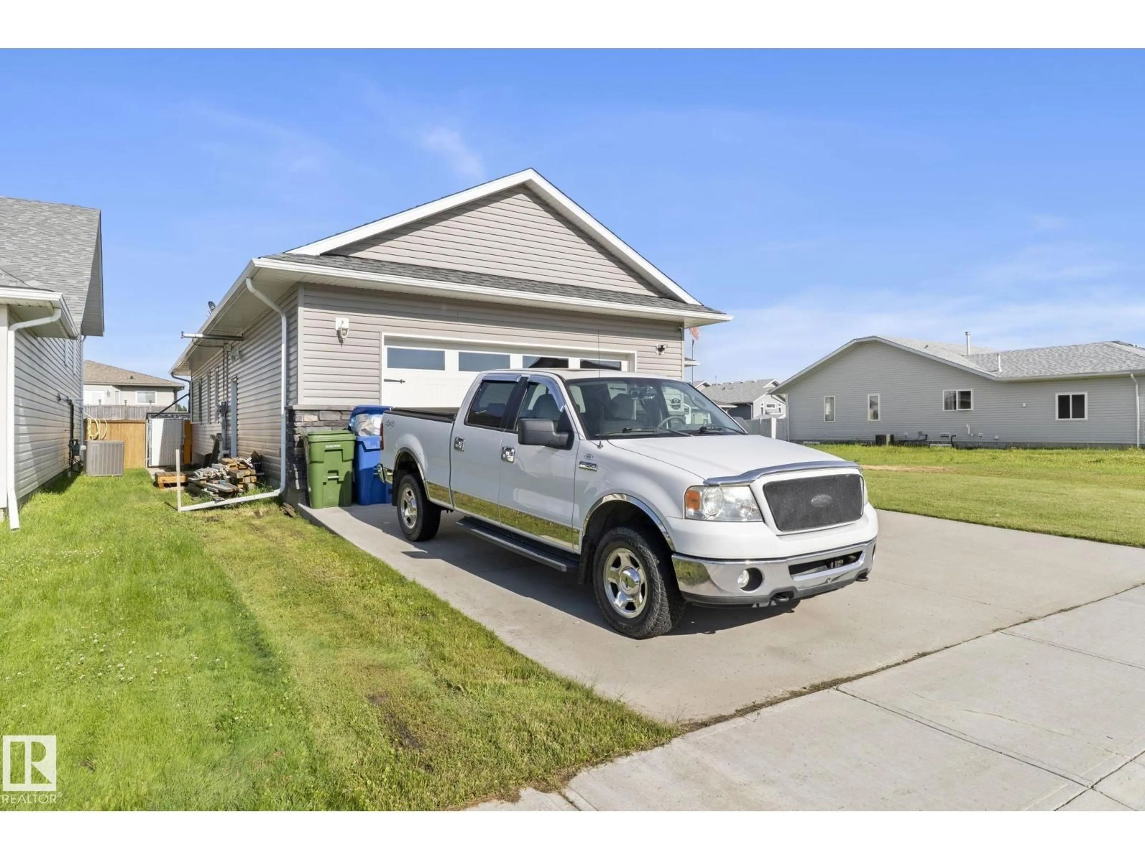 Home with vinyl exterior material, street for 4809 55 ST, Bruderheim Alberta T0B0S0