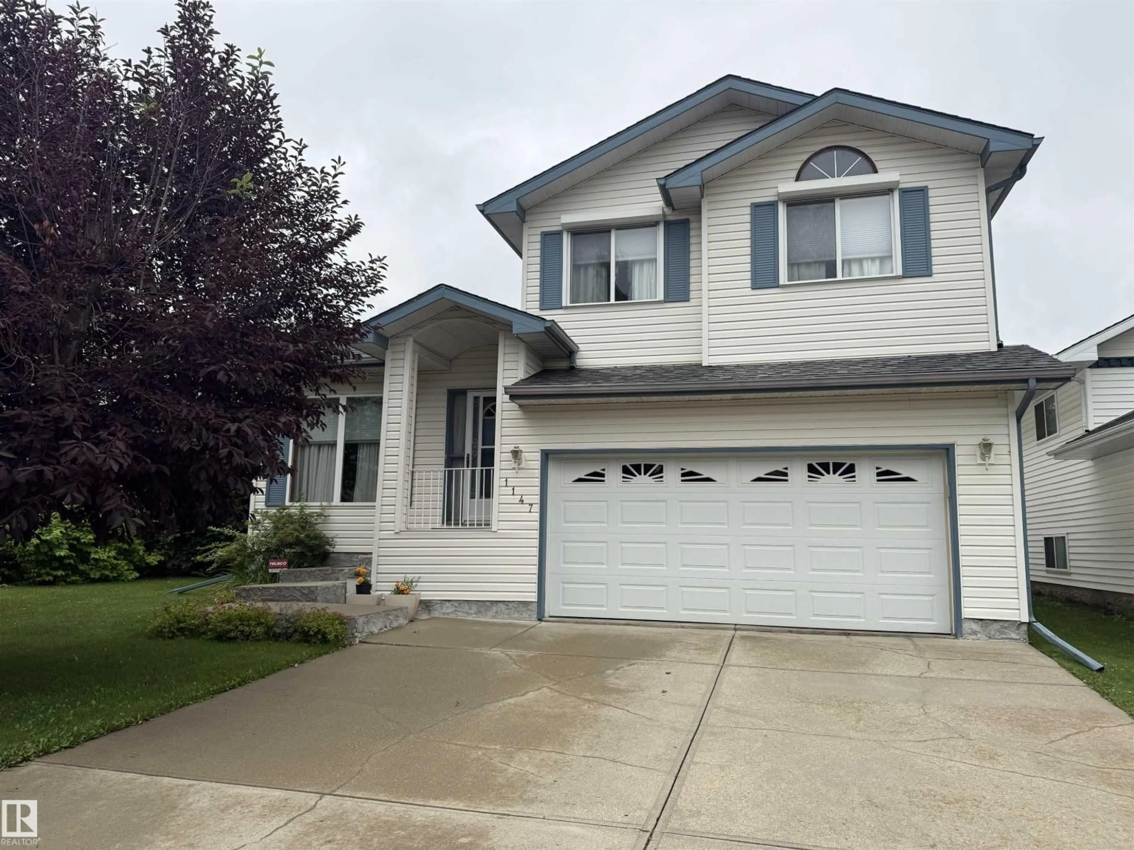 Home with vinyl exterior material, street for 1147 POTTER GREENS DR, Edmonton Alberta T5T5Y4