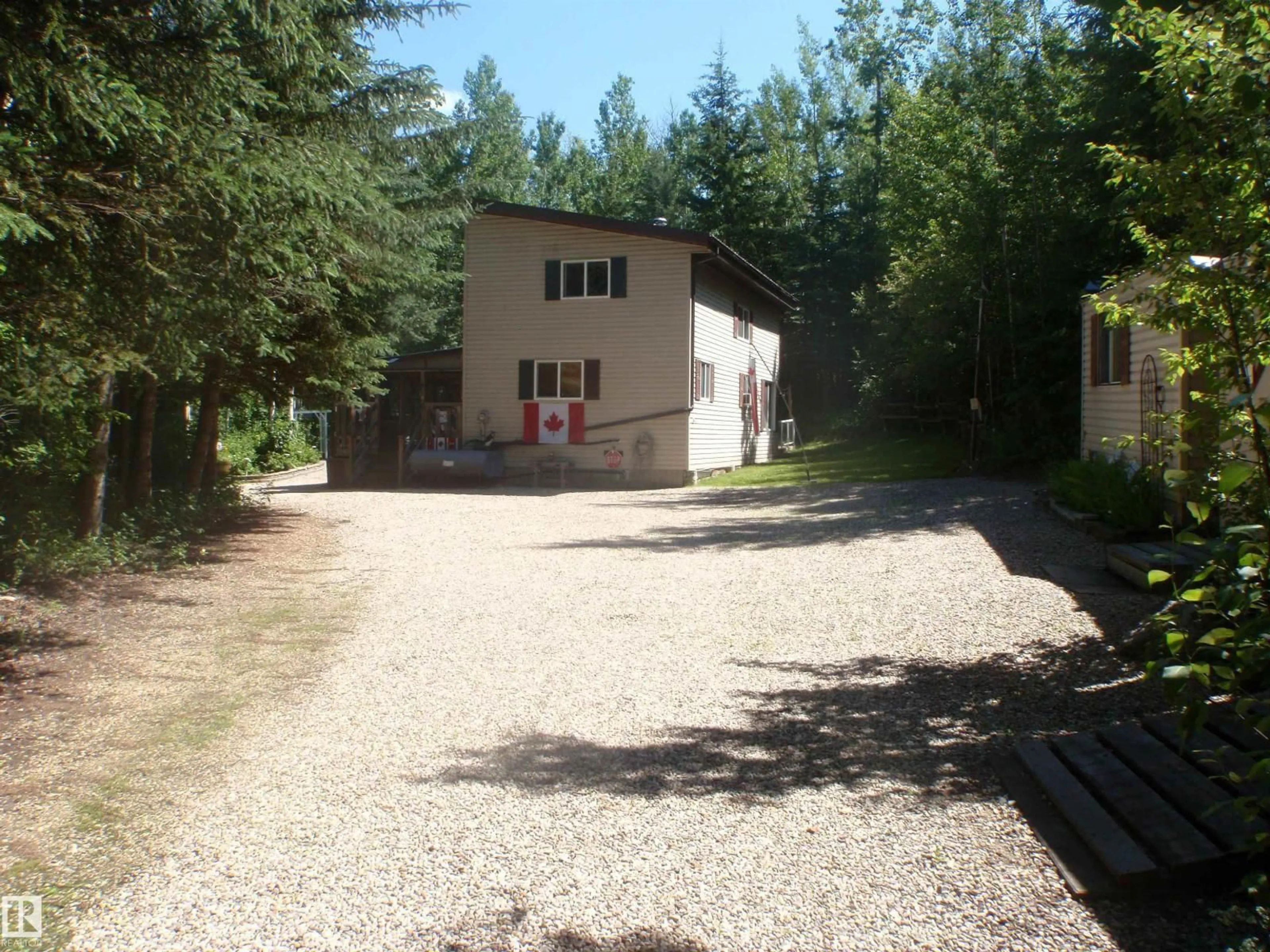 A pic from outside/outdoor area/front of a property/back of a property/a pic from drone, street for 59316 - 78 RNG RD 54, Rural Barrhead County Alberta T7N1N3