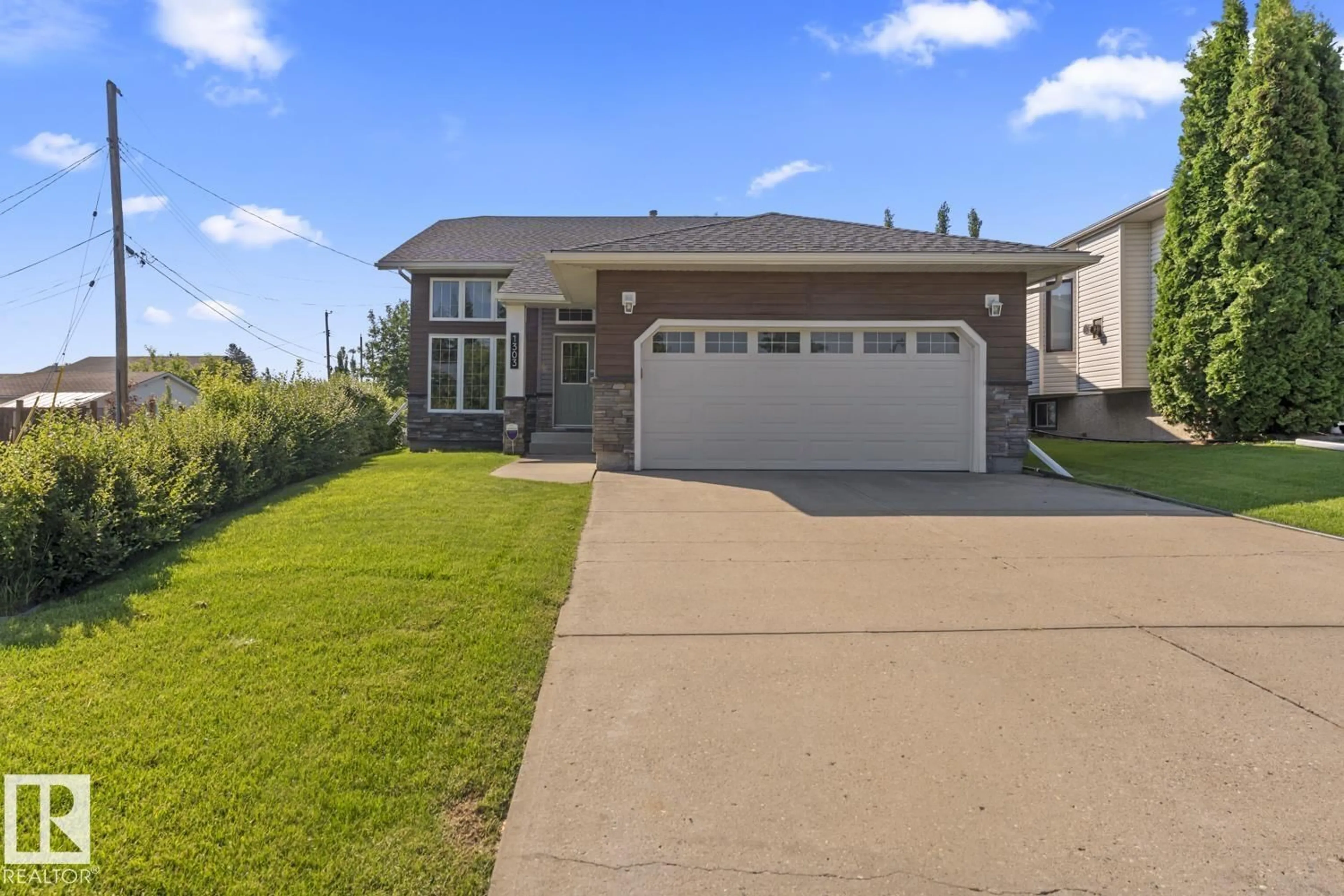 Home with vinyl exterior material, street for 1303 5 AV, Cold Lake Alberta T9M1C1