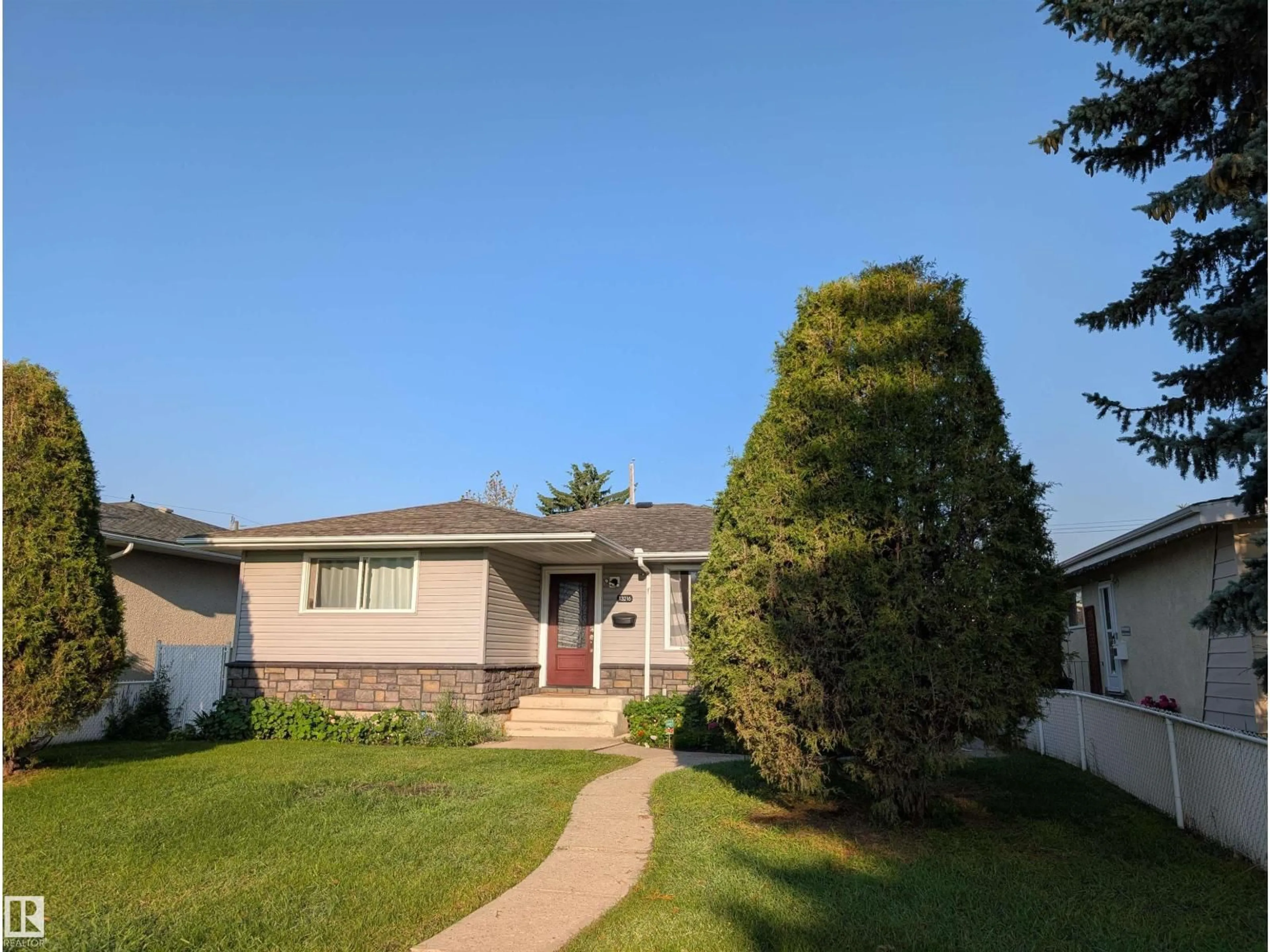 Home with vinyl exterior material, street for NW - 13216 117 ST, Edmonton Alberta T5E5K2