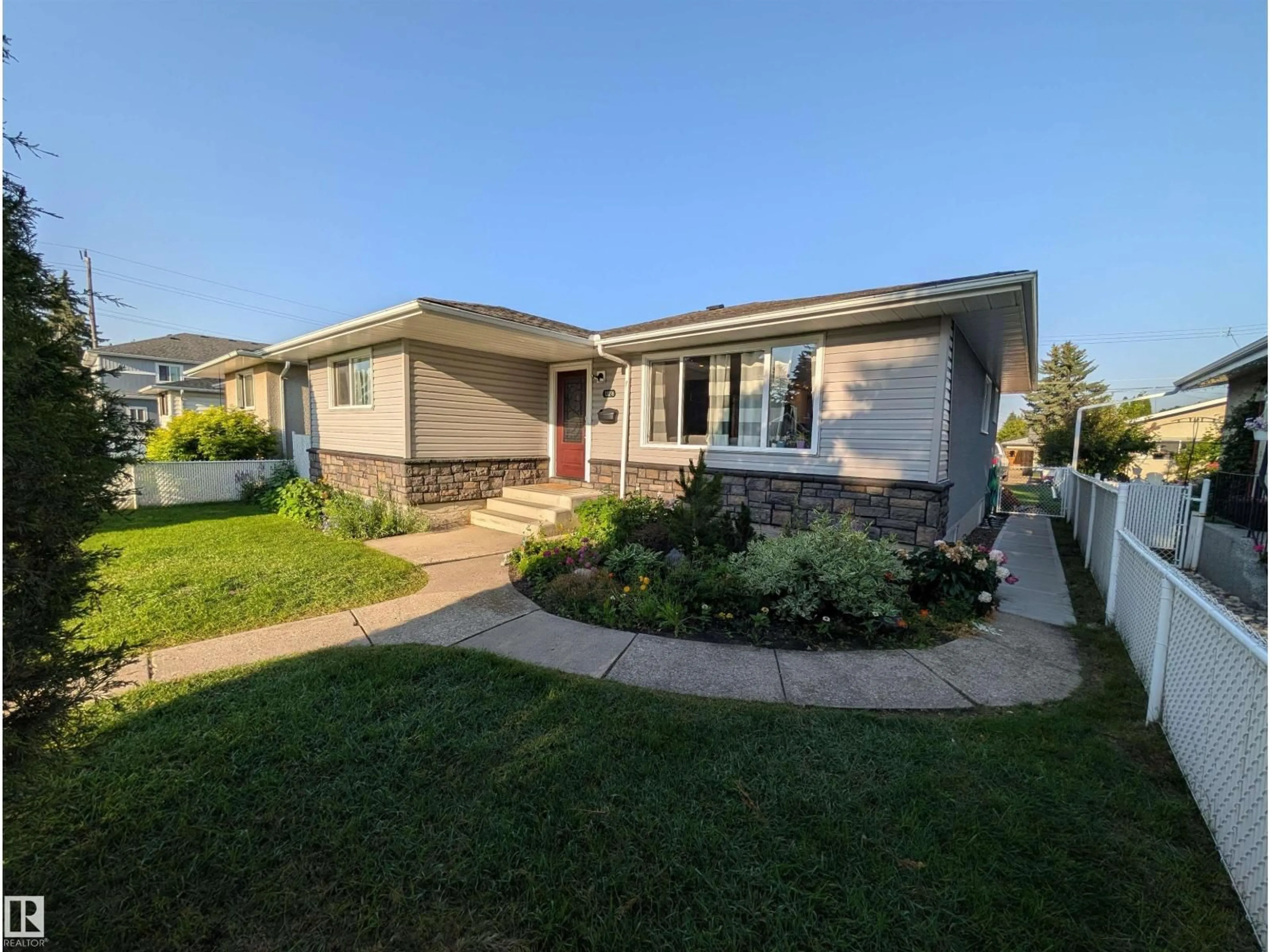 Home with vinyl exterior material, street for NW - 13216 117 ST, Edmonton Alberta T5E5K2
