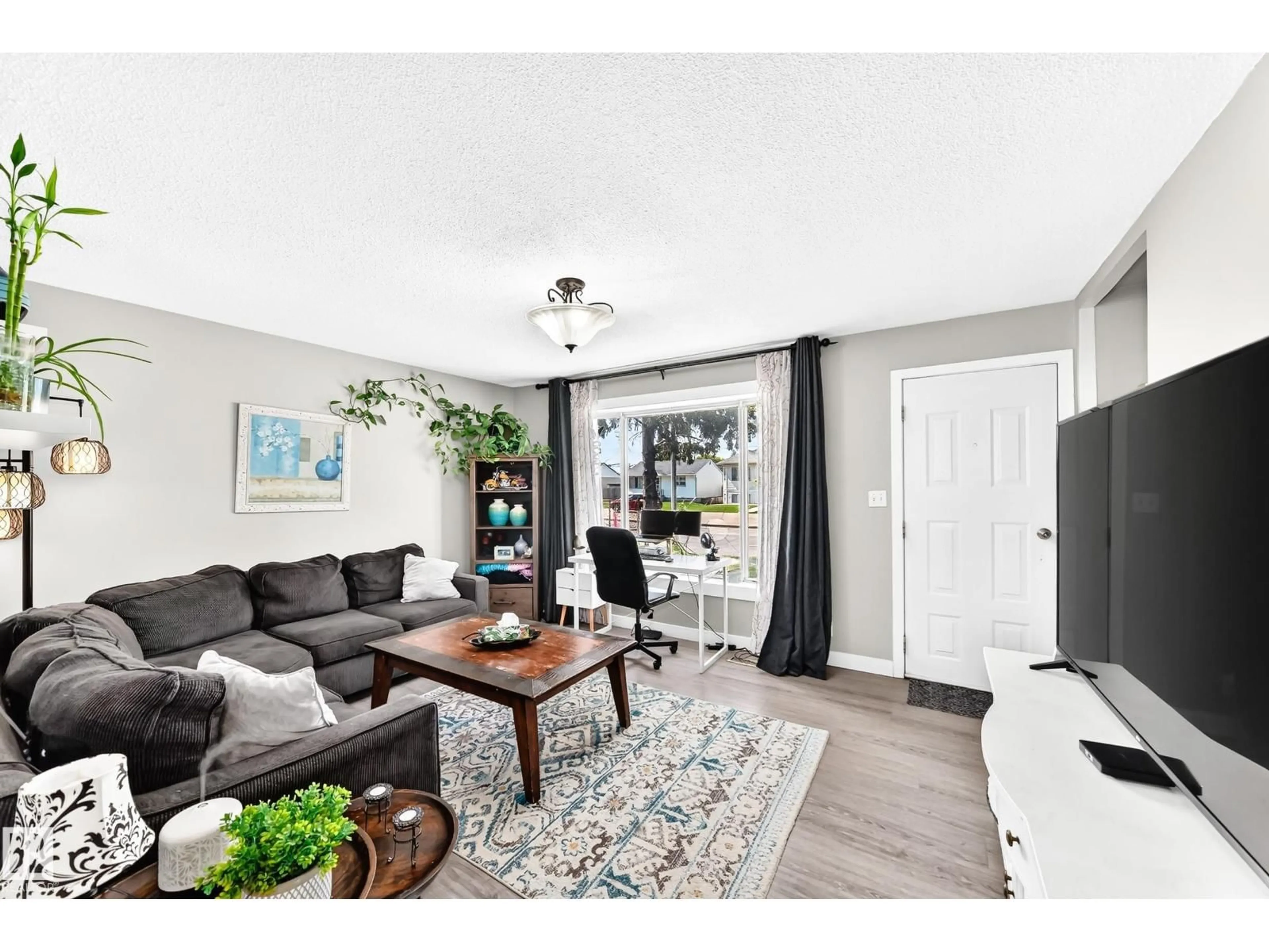 Living room with furniture, wood/laminate floor for NW - 9911 163 ST, Edmonton Alberta T5P3N3